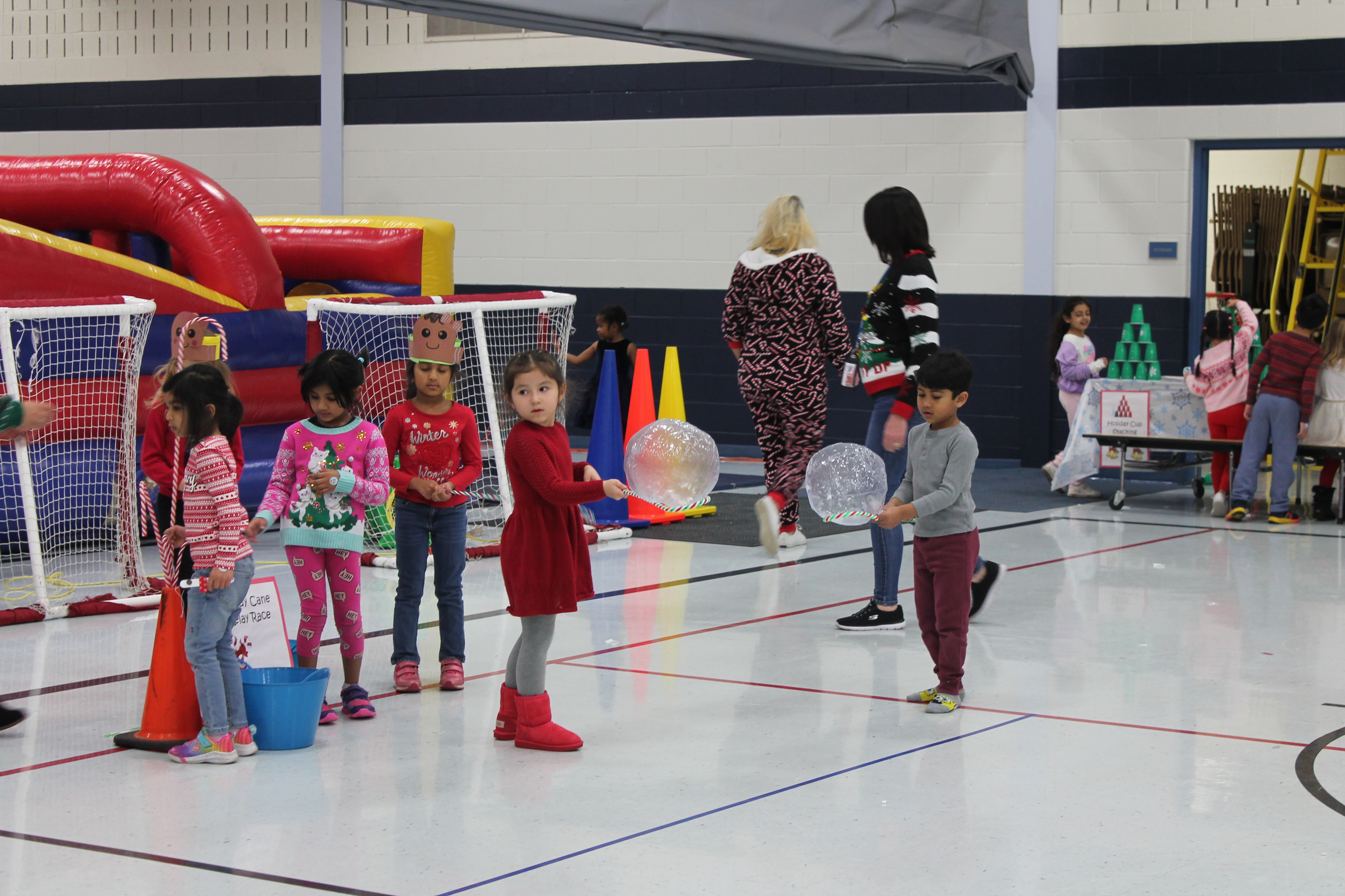 Students enjoy holiday games and crafts at winter-themed parties.