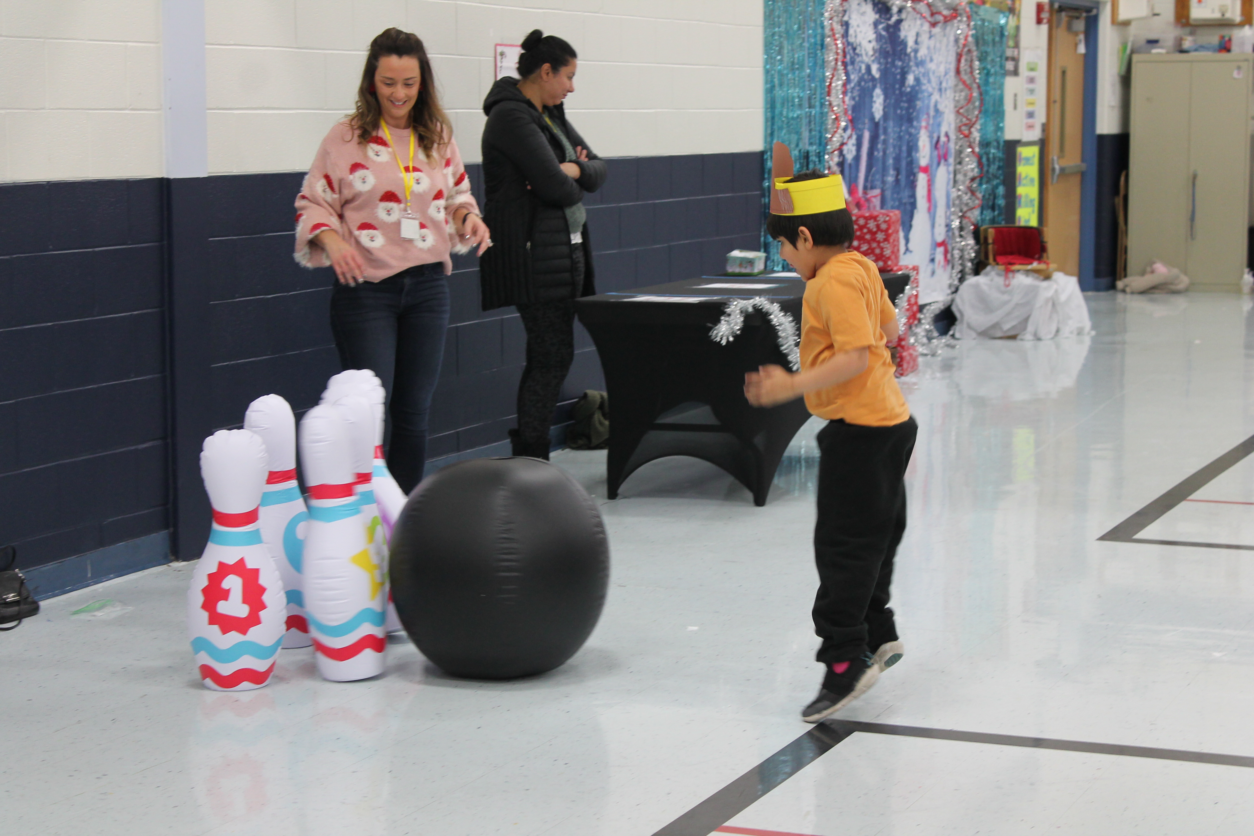 Students enjoy holiday games and crafts at winter-themed parties.