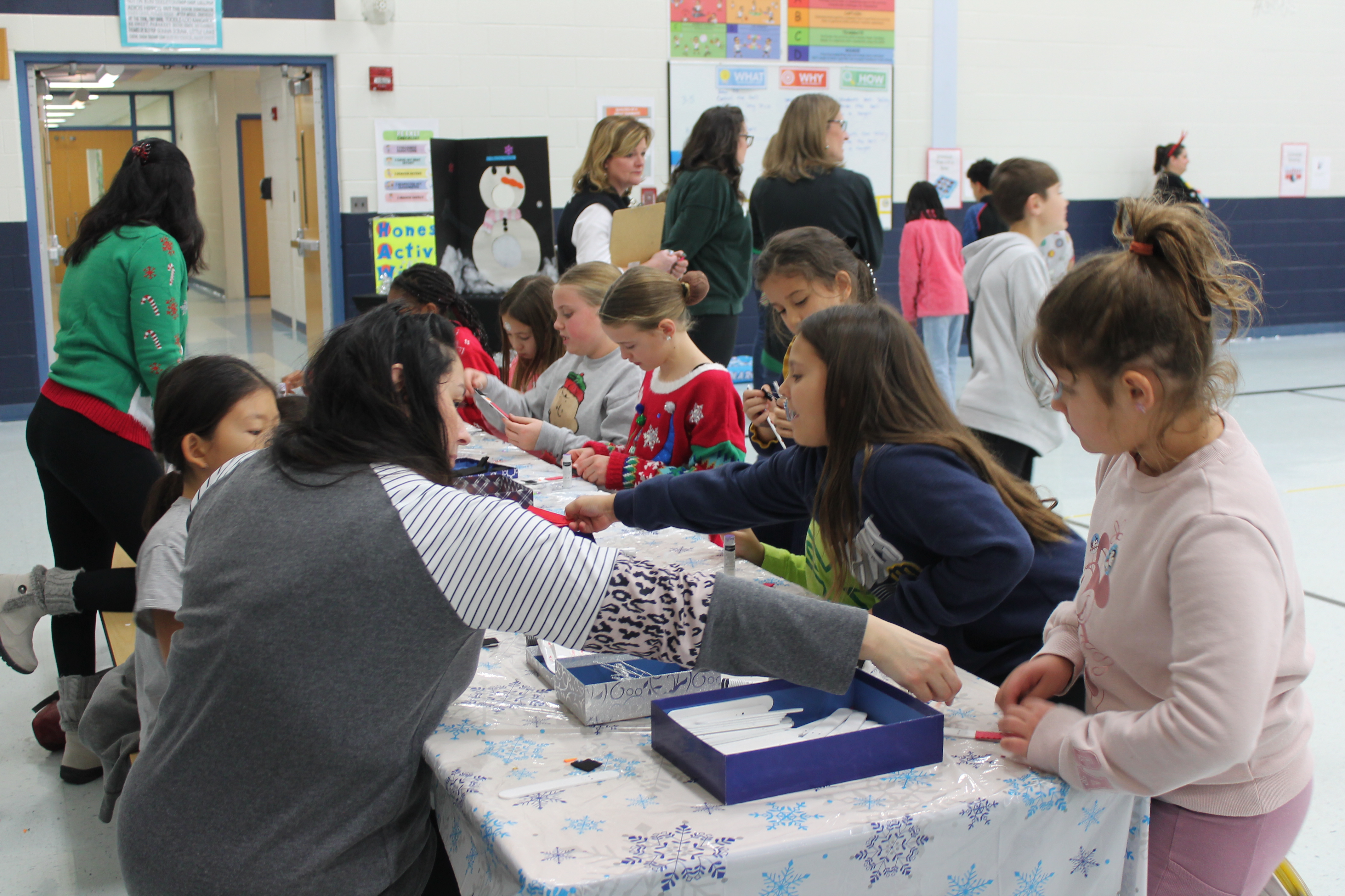 Students enjoy holiday games and crafts at winter-themed parties.