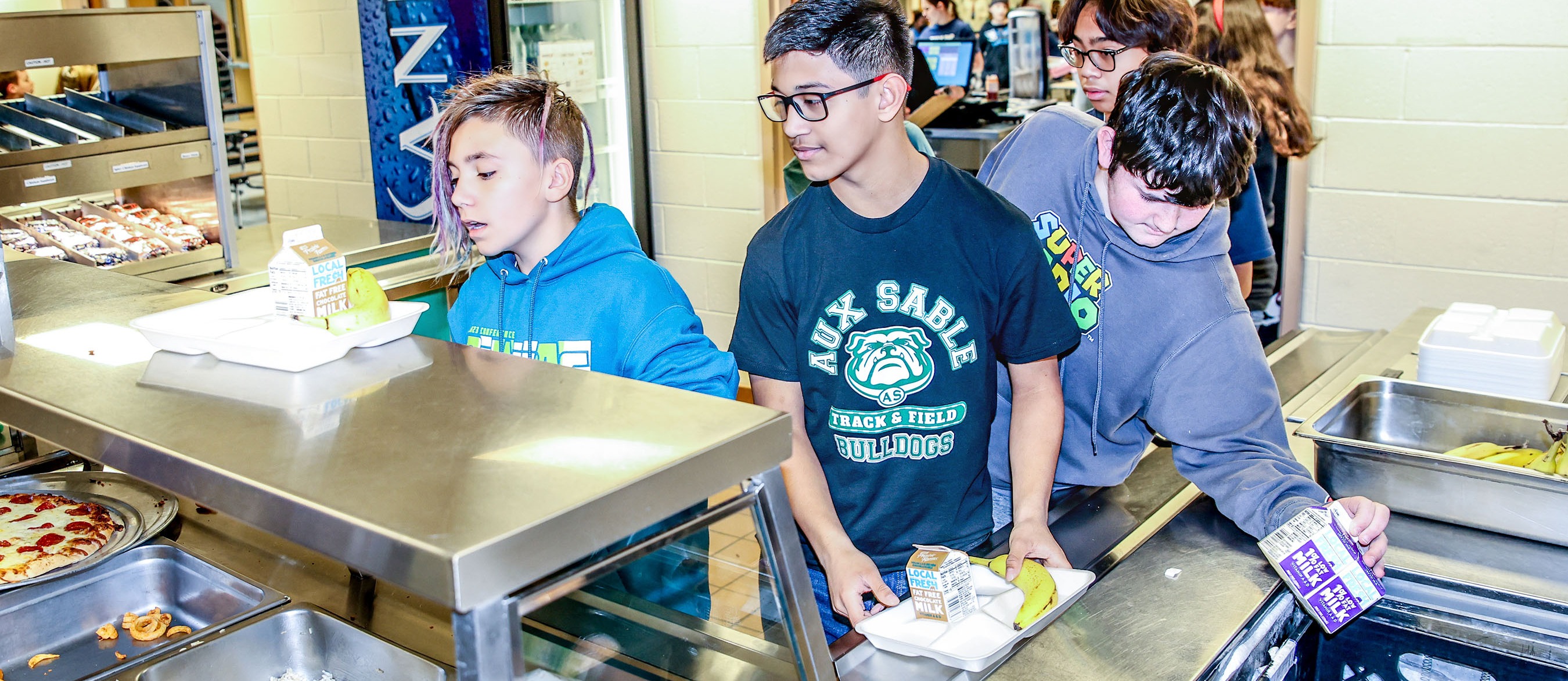 students getting lunch in cafeteria line