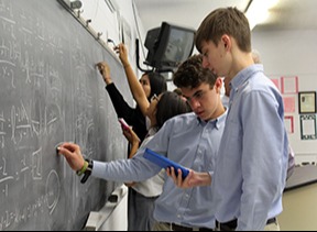 students working on the board