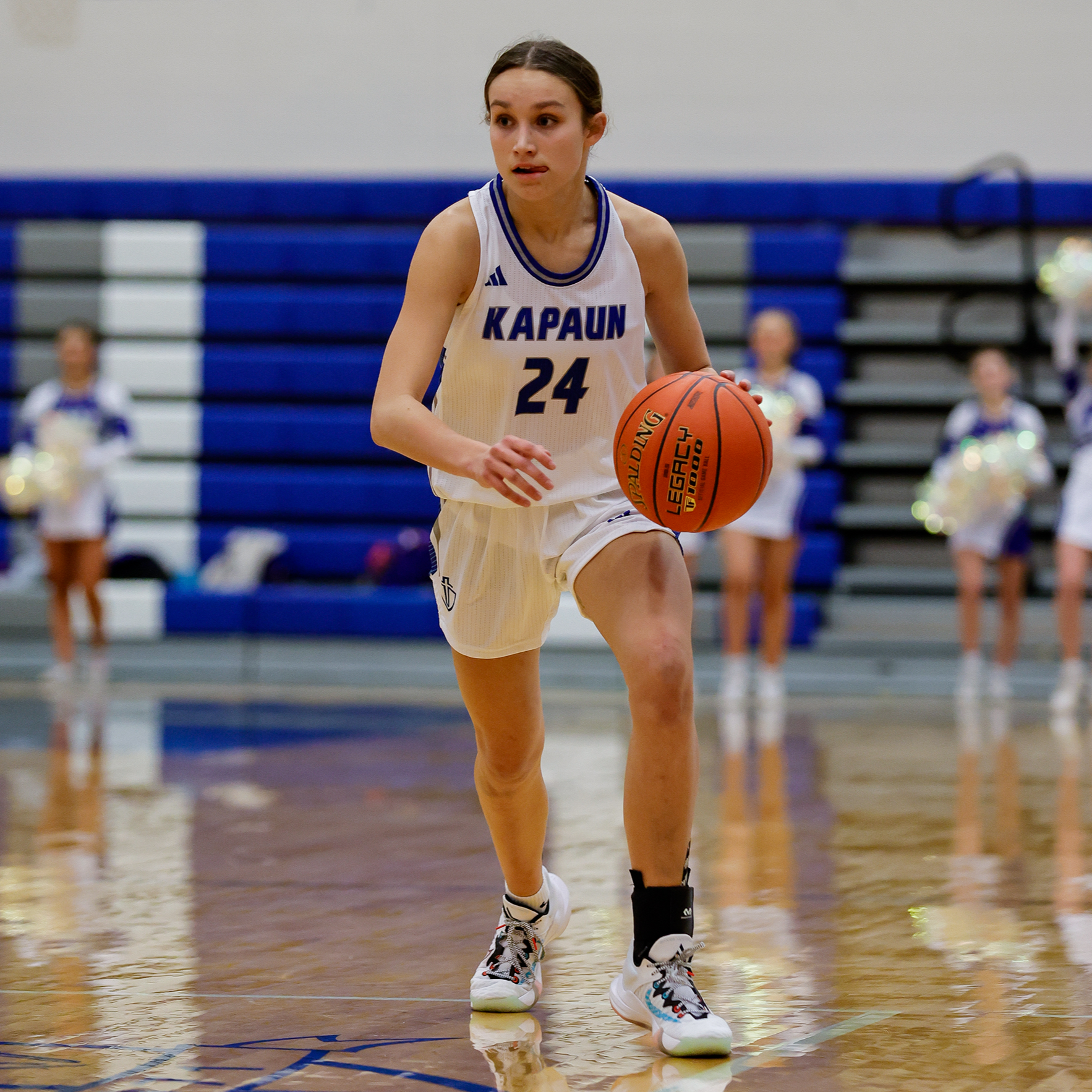 McCoy Phister takes the ball down the court