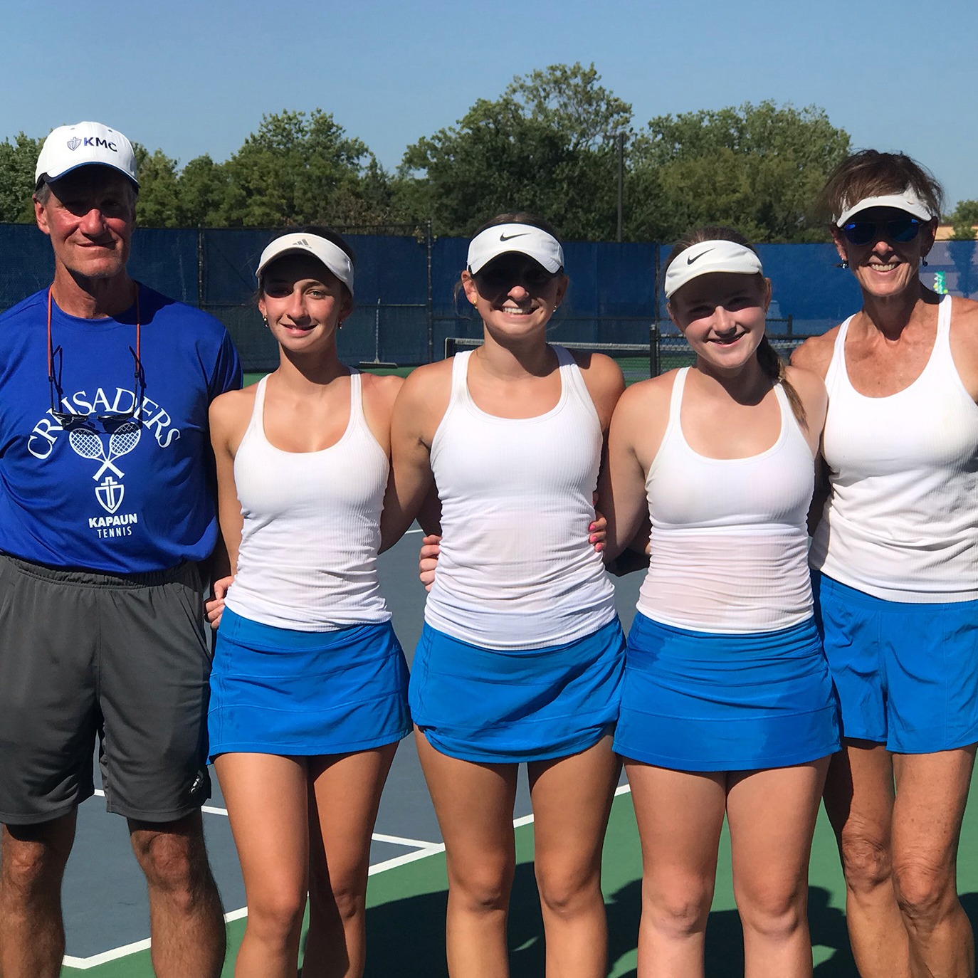 Tennis players pose for a picture