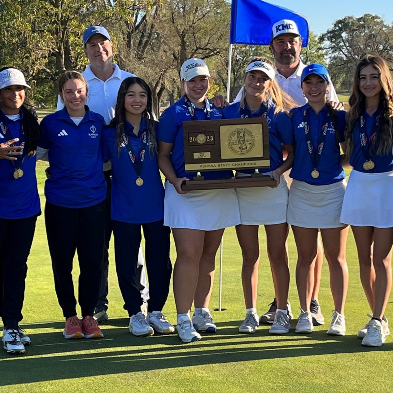 Girls Golf team poses for team picture after winning a state championship