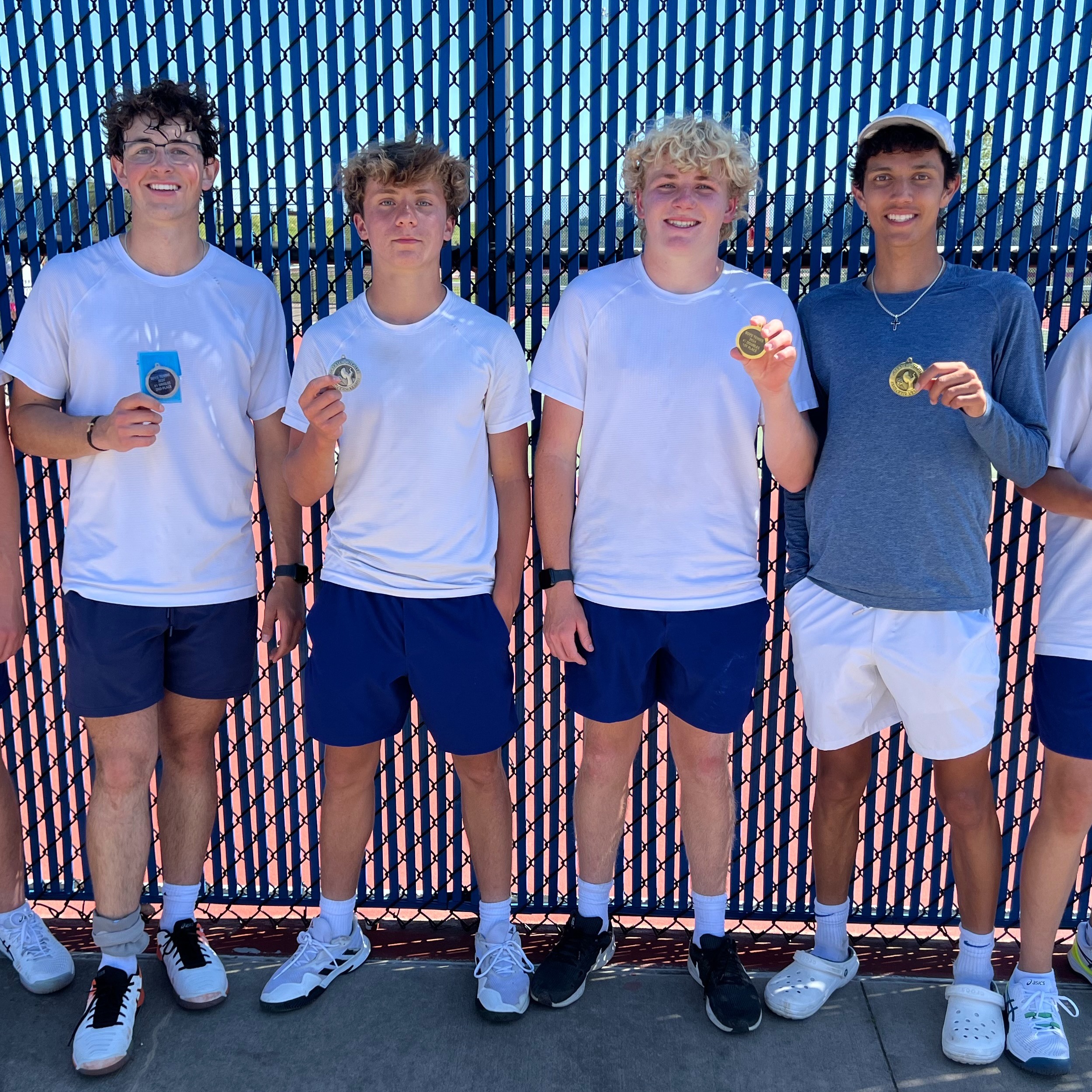 Boys tennis poses with their medals from the GWAL meet