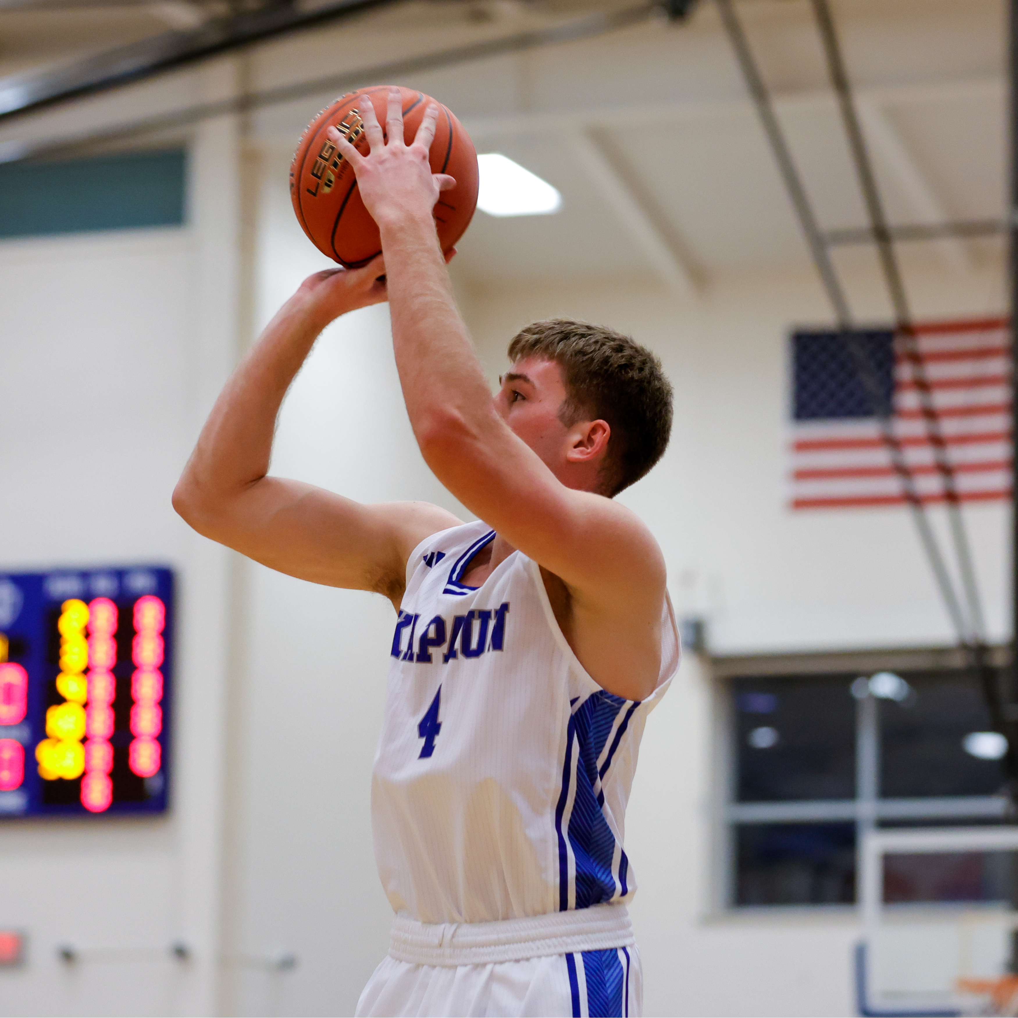 Boys Basketball Player Shooting Ball