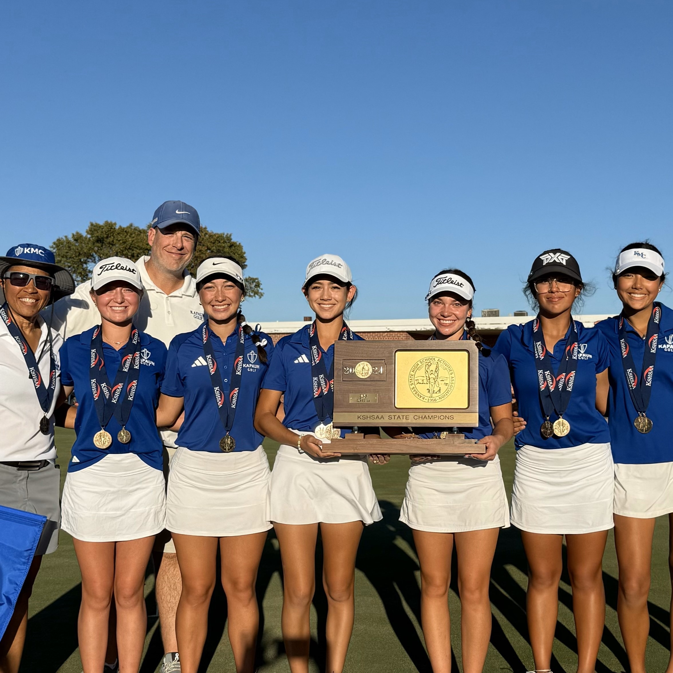Girls Golf team poses for team picture after winning a state championship
