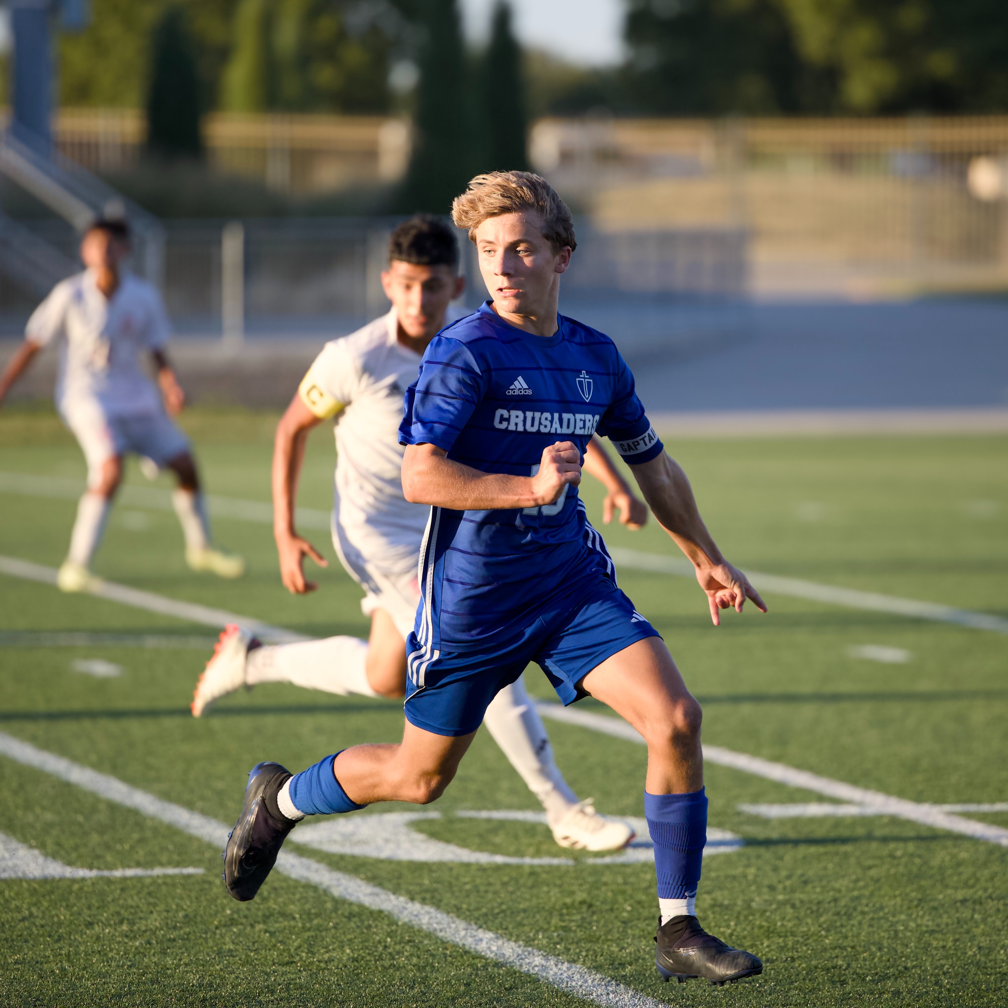 Soccer player running for ball
