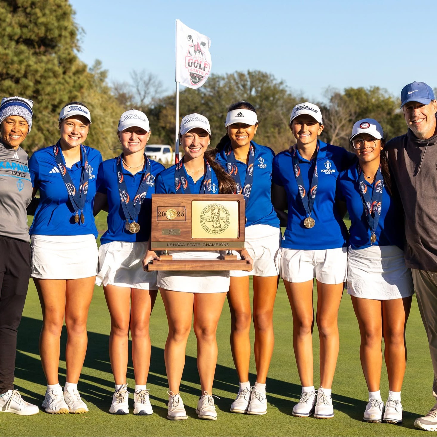 Girls Golf team poses for team picture after winning state championship