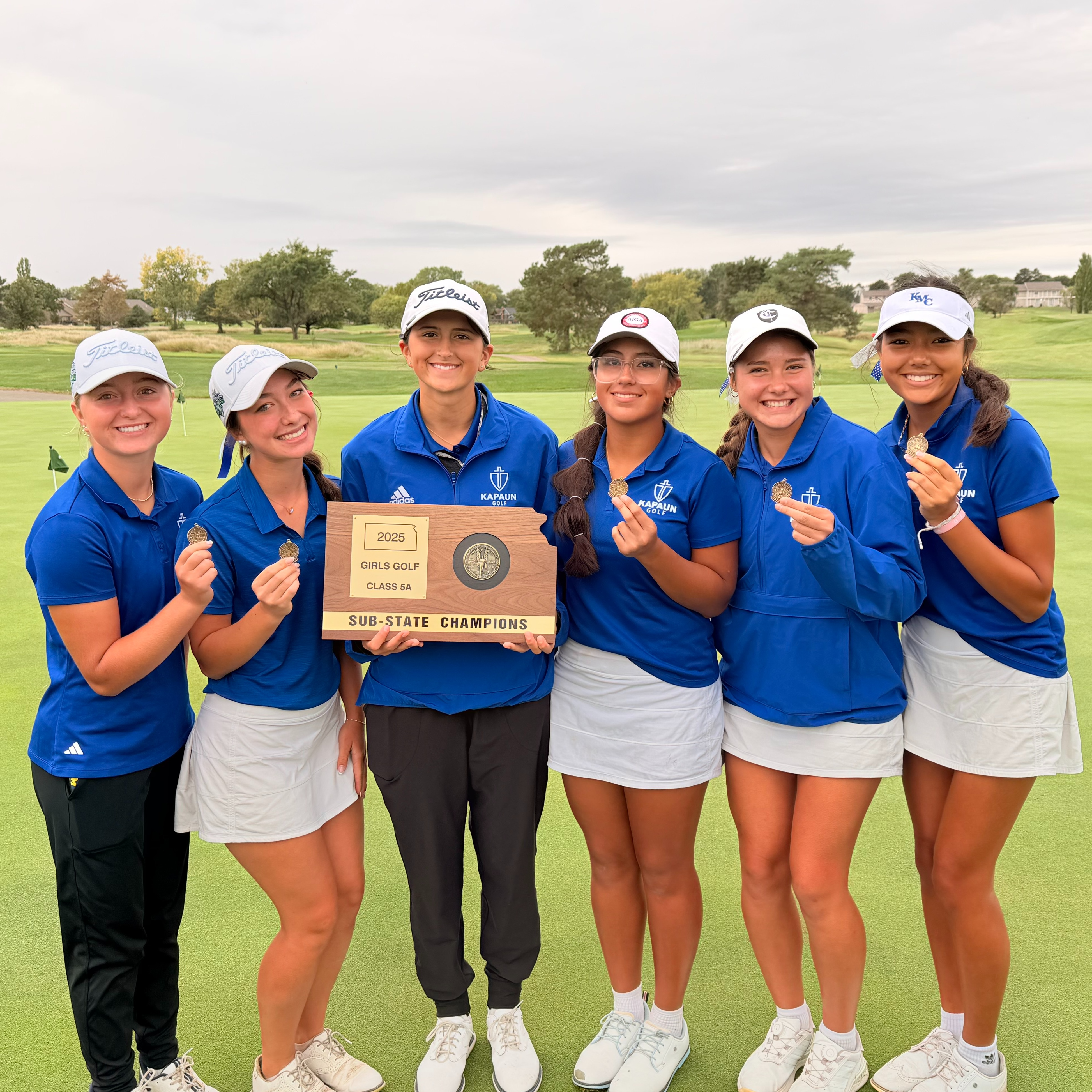 Girls team poses with sub-state championship  plaque