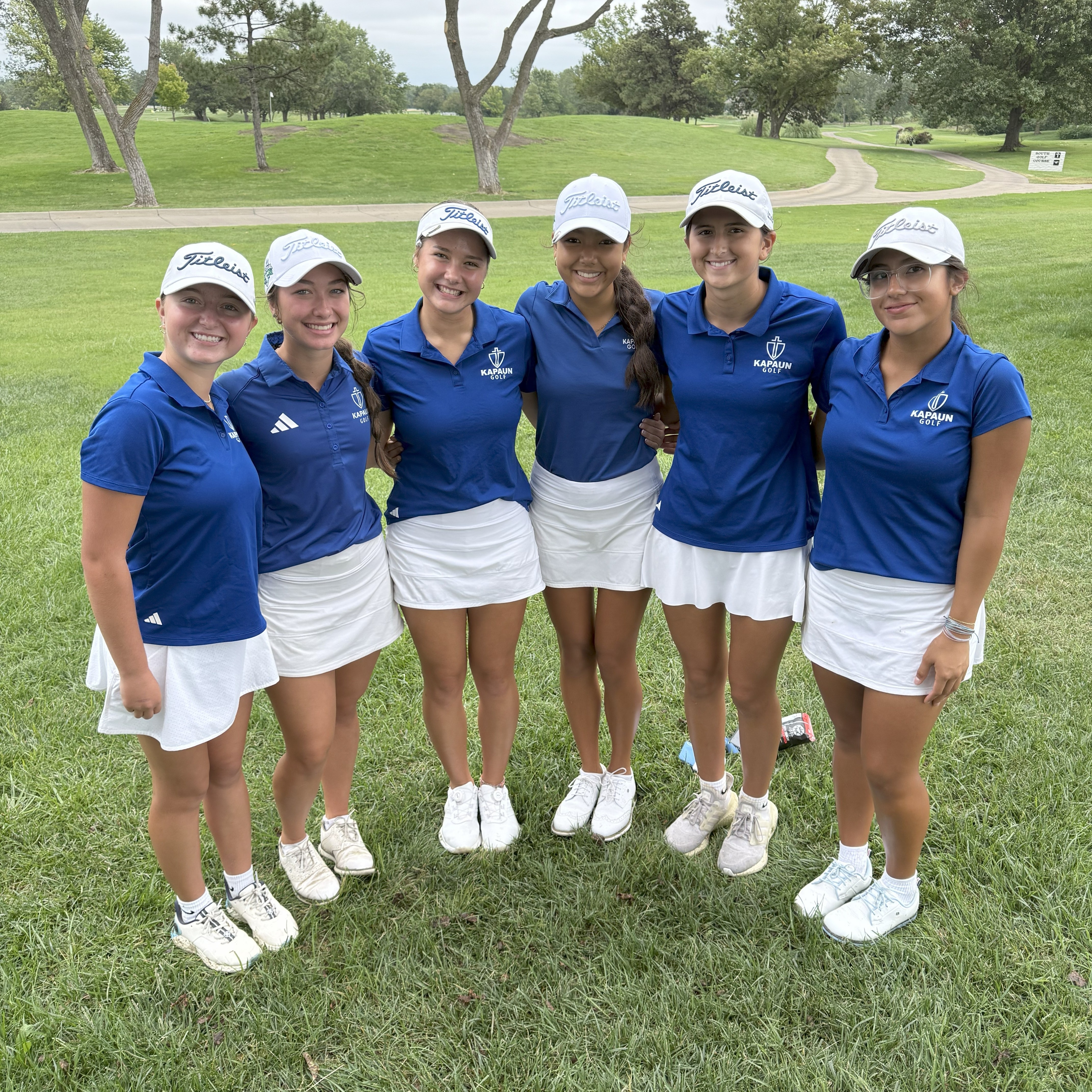 Girls golf team posing after winning the Andover Invitational, their first tournament of the season