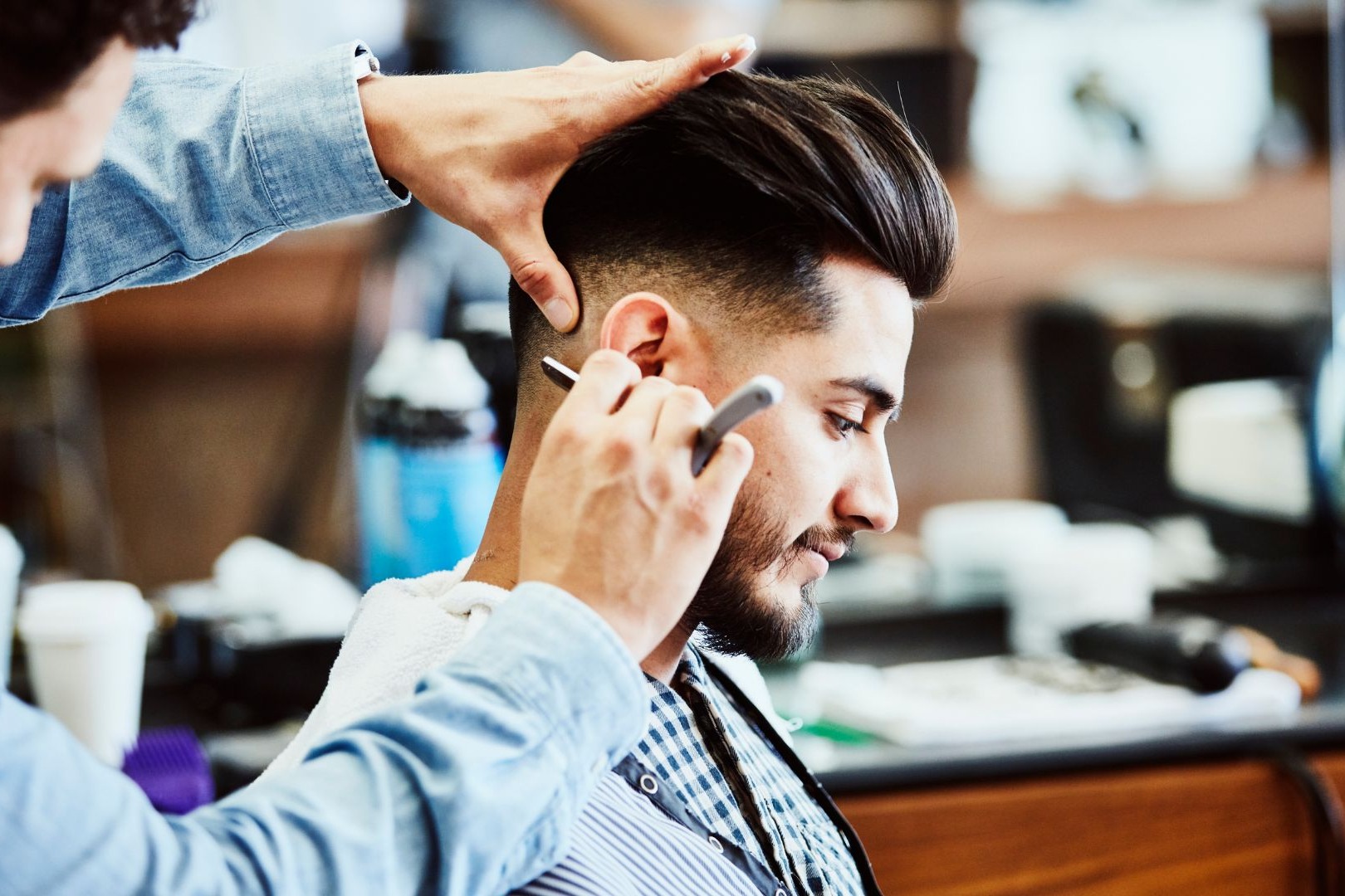 Man receiving haircut.