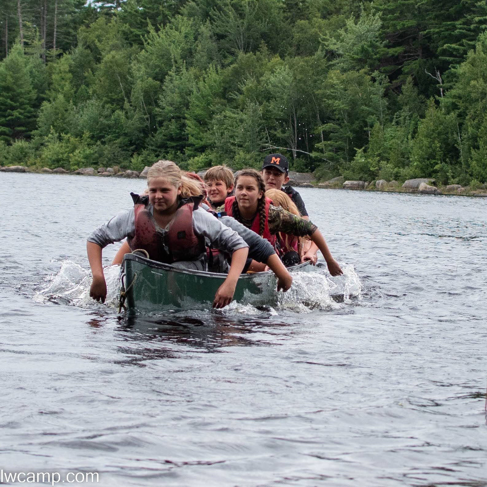 Students enjoying canoeing challenges 
