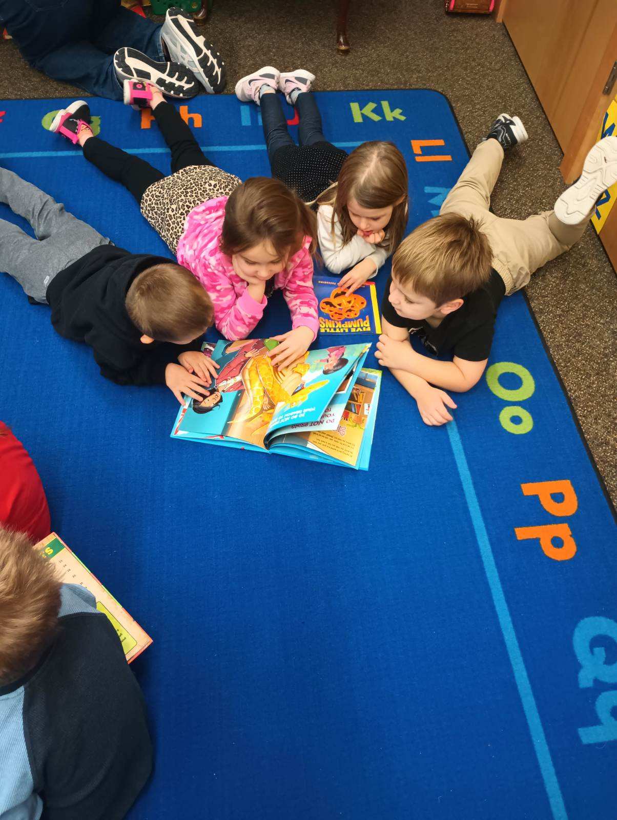 Sharing a book with friends!