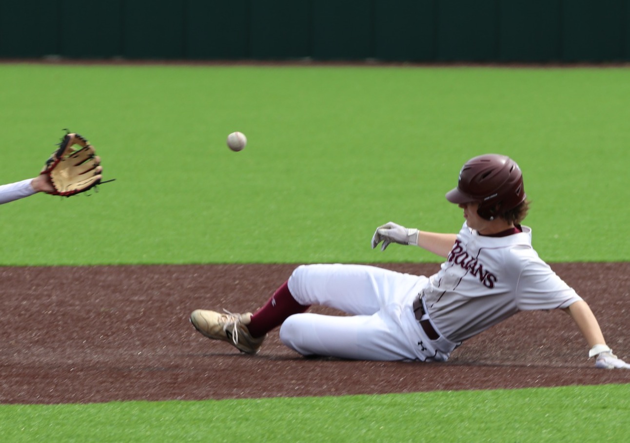 baseball player sliding into base