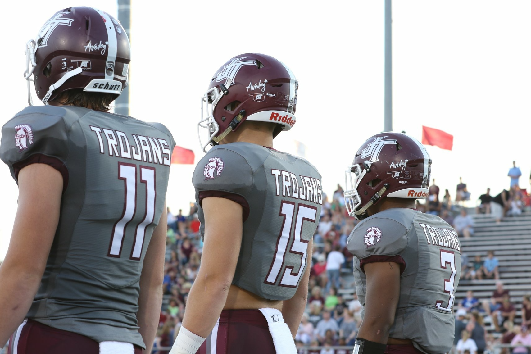 Three Football Players standing in a line