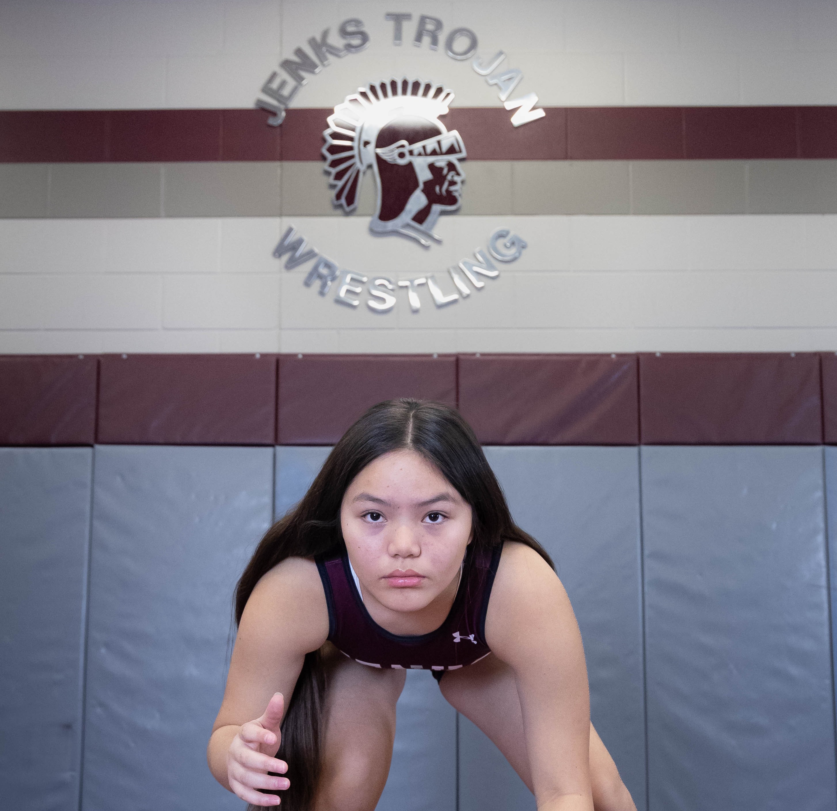 girl down in wrestling stance