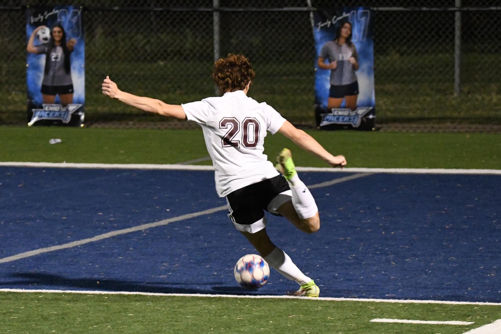 boy kicking soccer ball