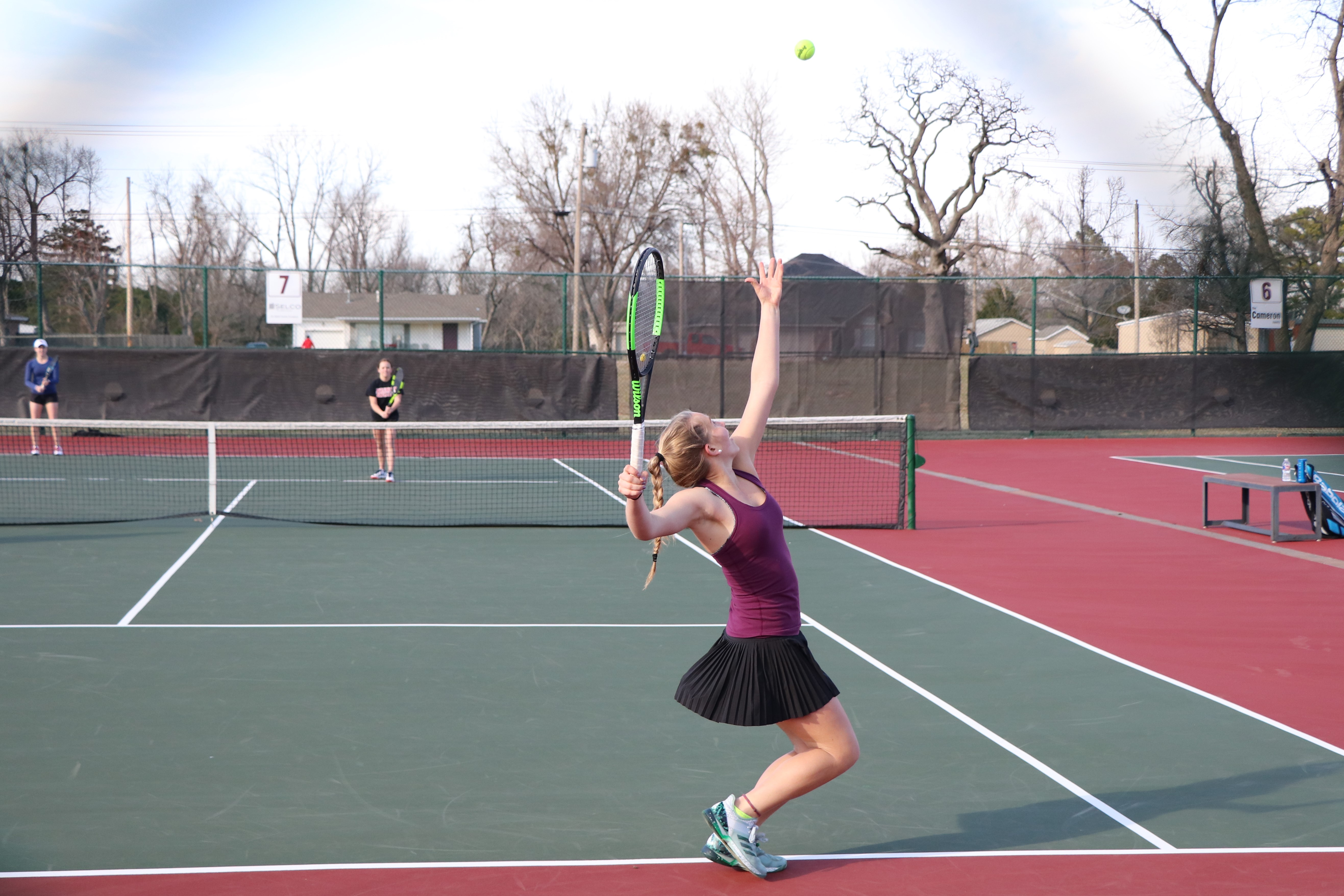 GIrl hitting tennis ball