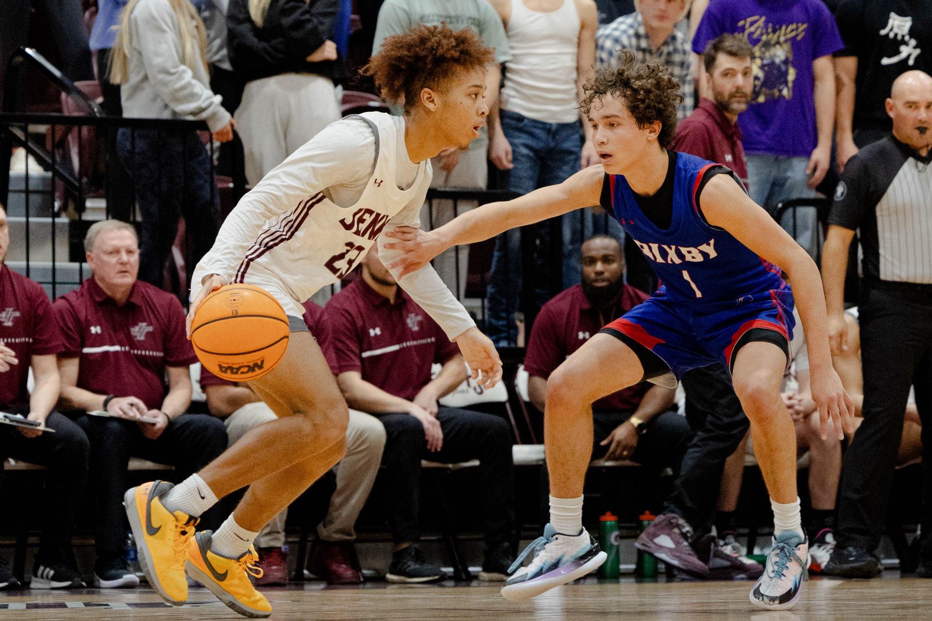 boy dribbling basketball