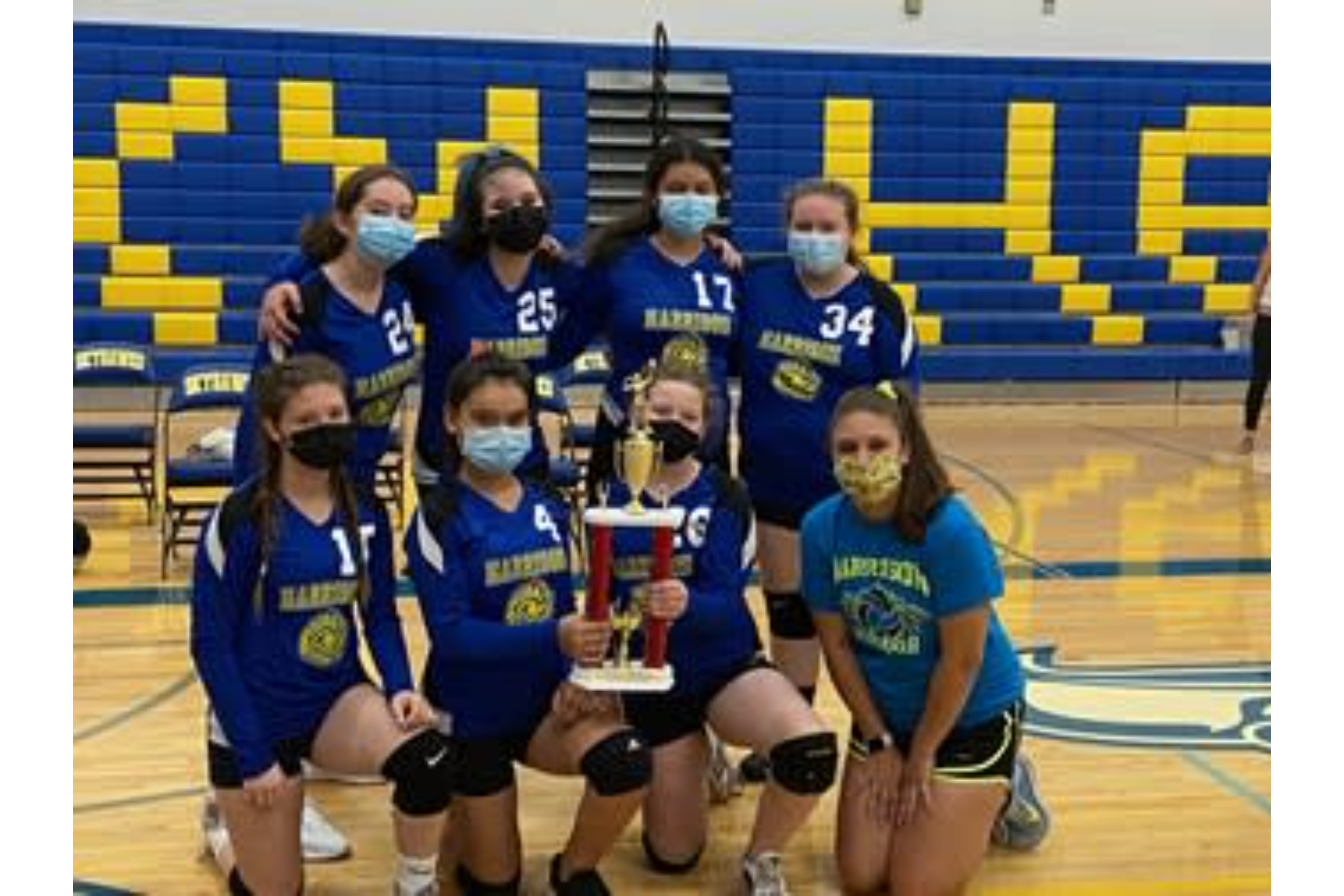 Volleyball team with a trophy
