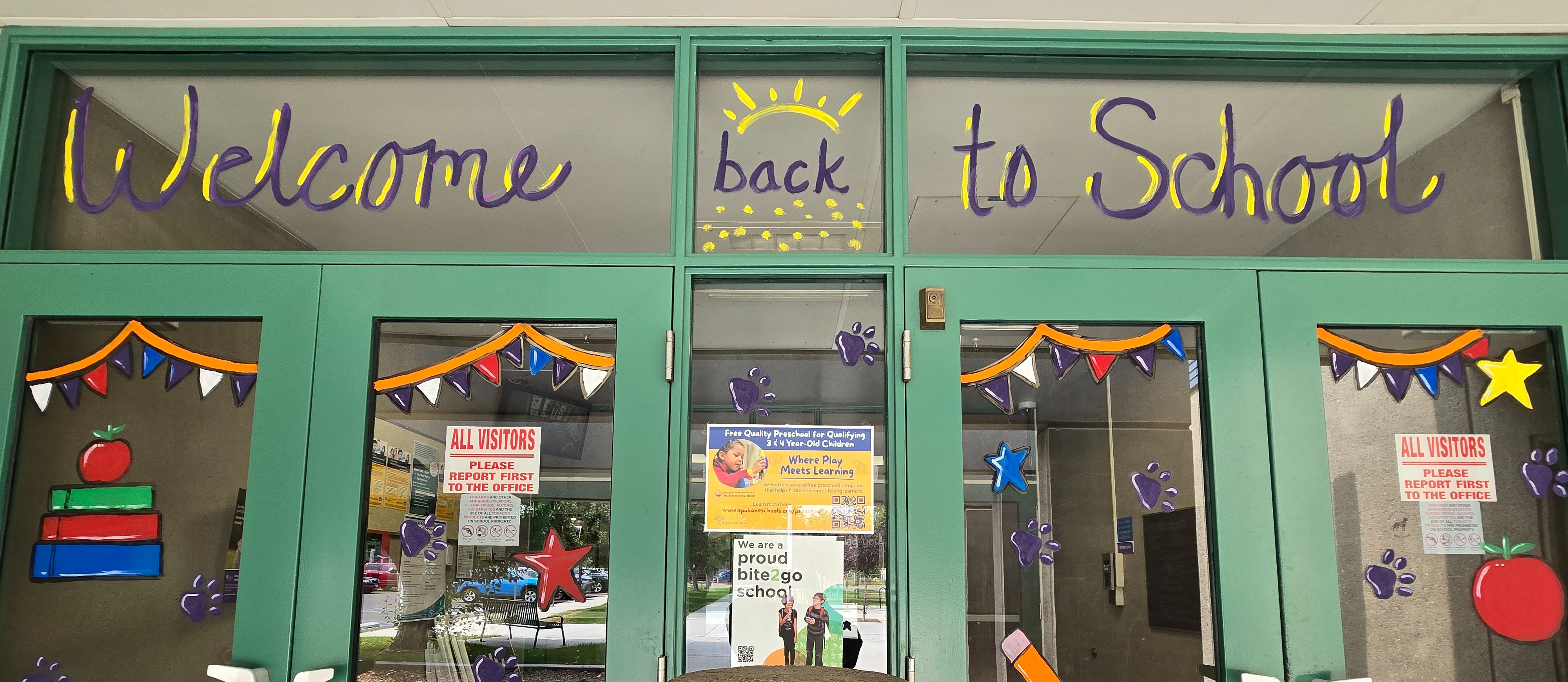 Welcome Back to School written in paint on front doors
