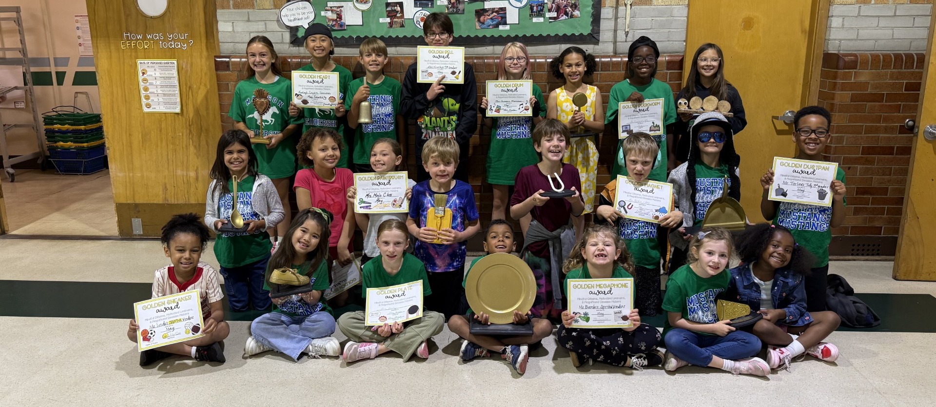 Madison students with golden awards