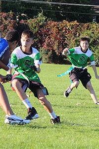 Two boys playing football