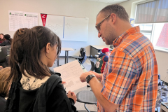 Mr. Anderson helping a student with math