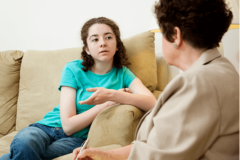 student talking to therapist