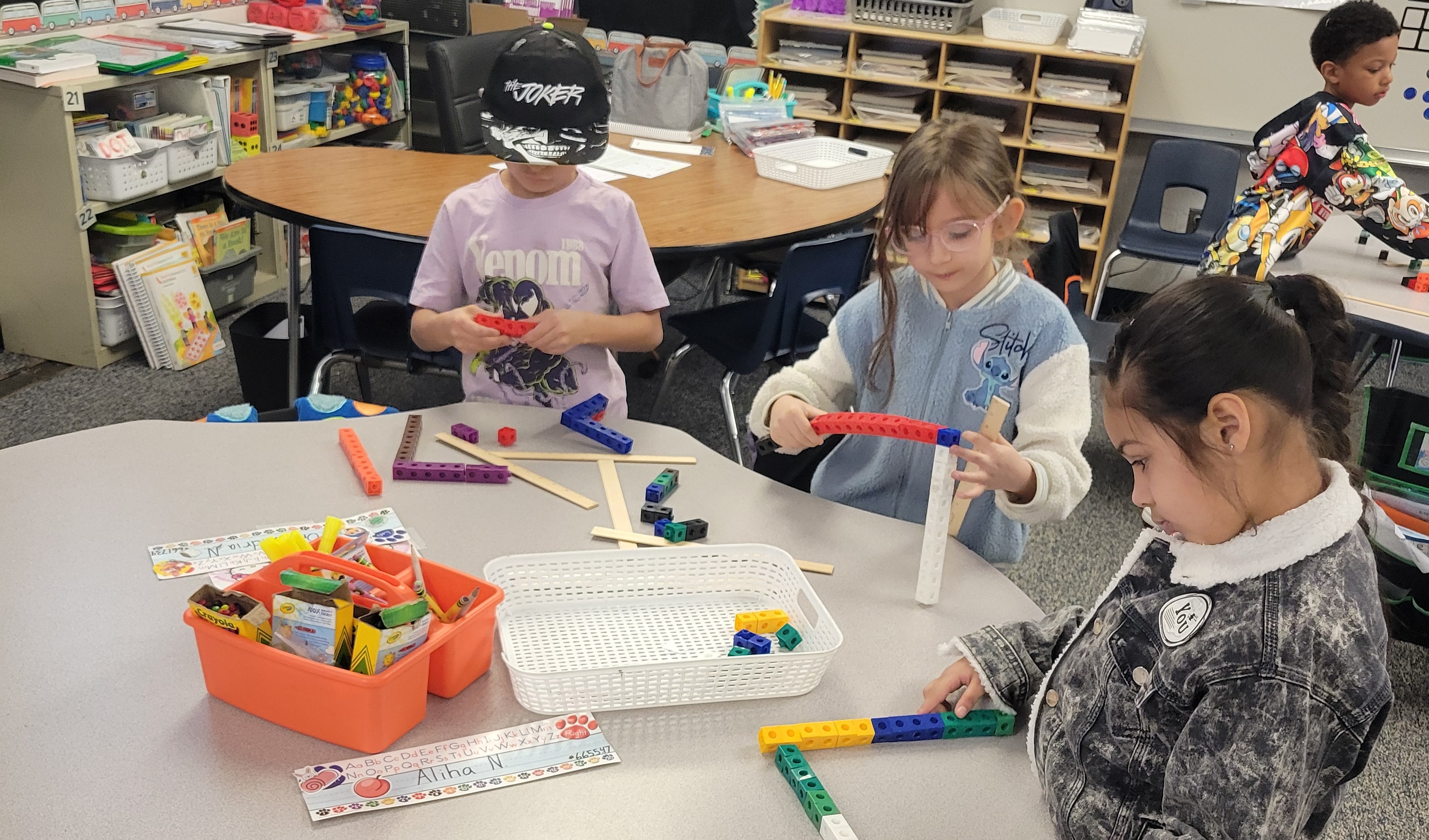 Students learning with interactive blocks