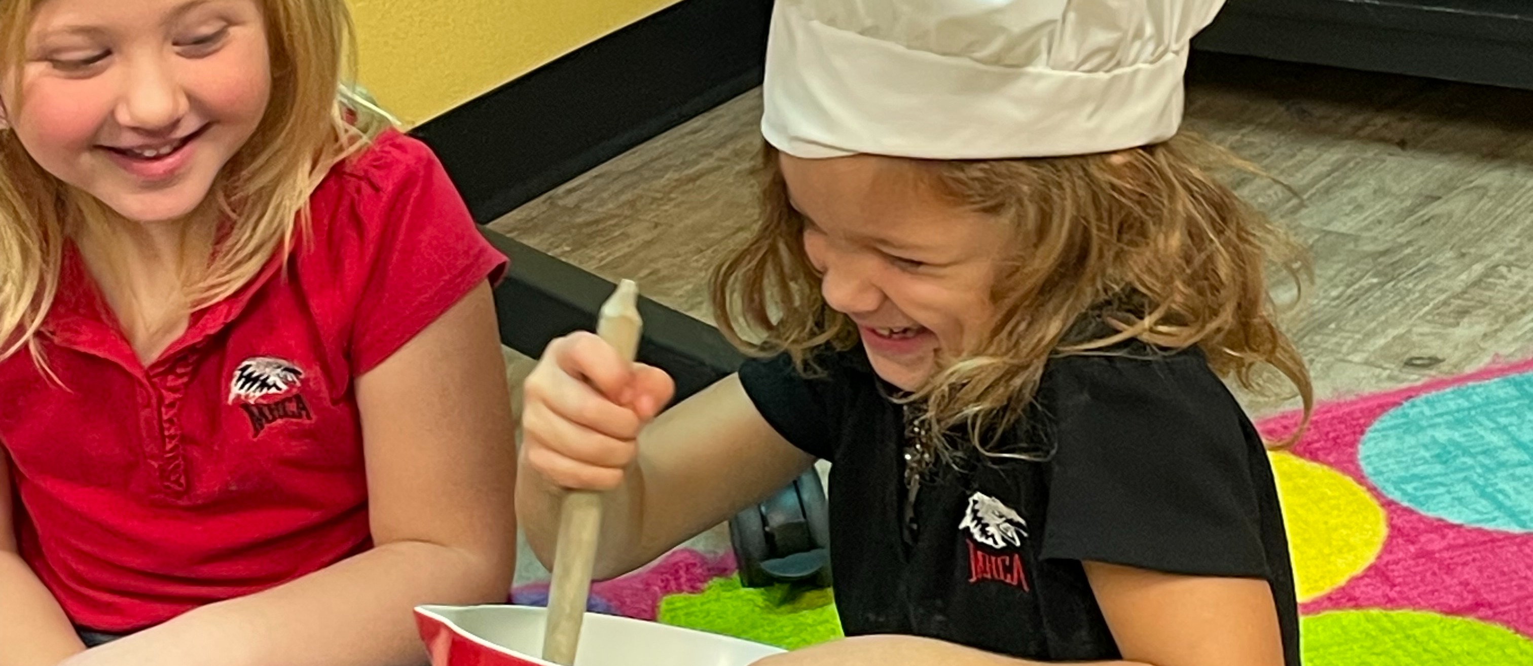 girls pretending like they are baking