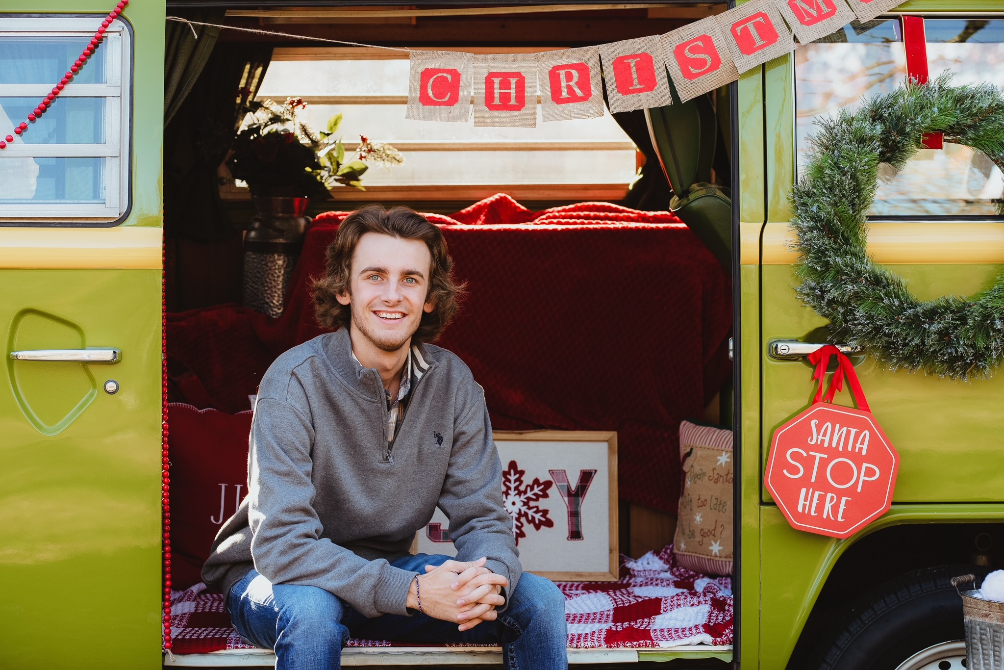 young man taking a picture for Christmas