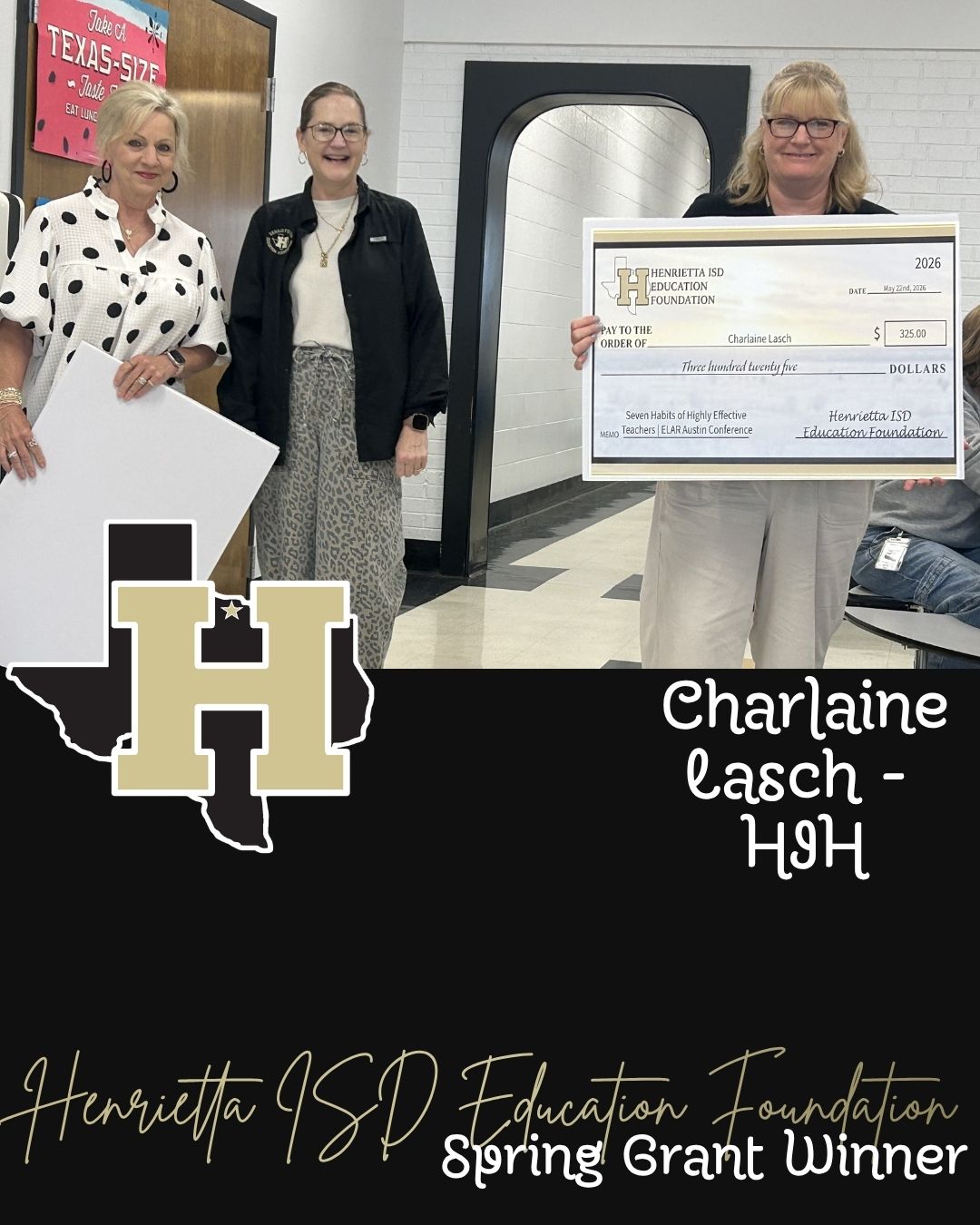 Three women holding a check and a sign with "Charlaine Lasch - HJH" inside a school hallway.