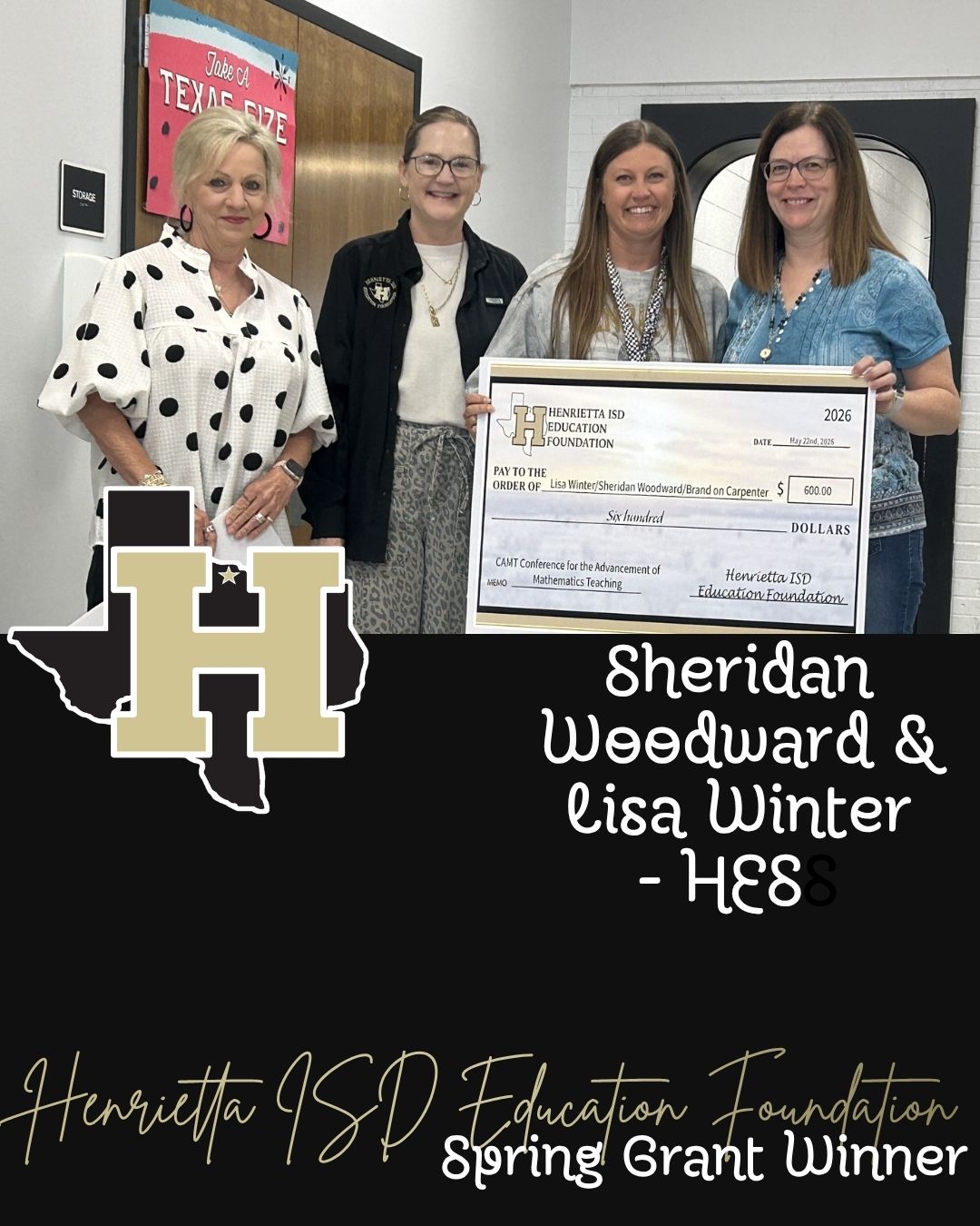 Four women stand together holding a large check in front of a building with a sign for Henrietta ISD Education Foundation.