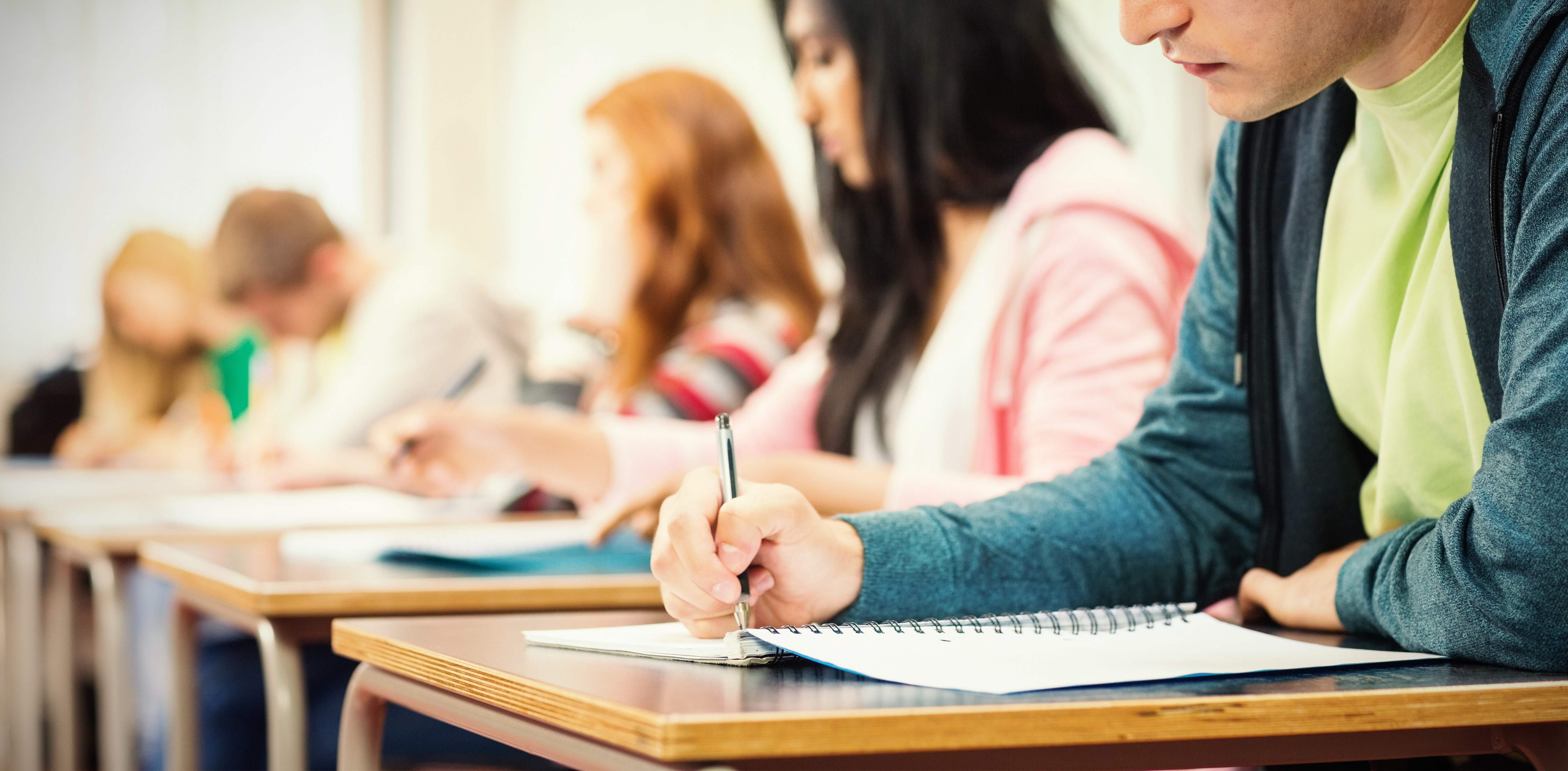 Students working at their desk in notebooks