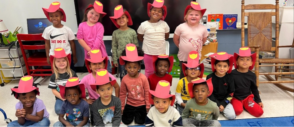 Students with fire fighter hats on