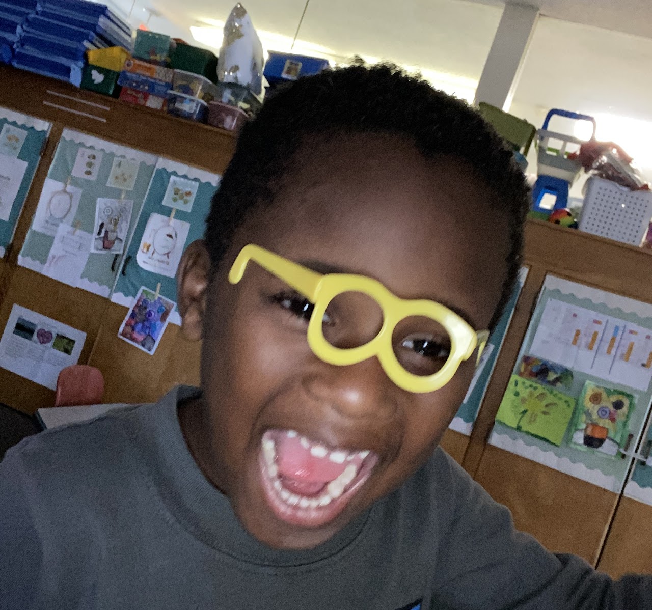 Student with glasses smiling