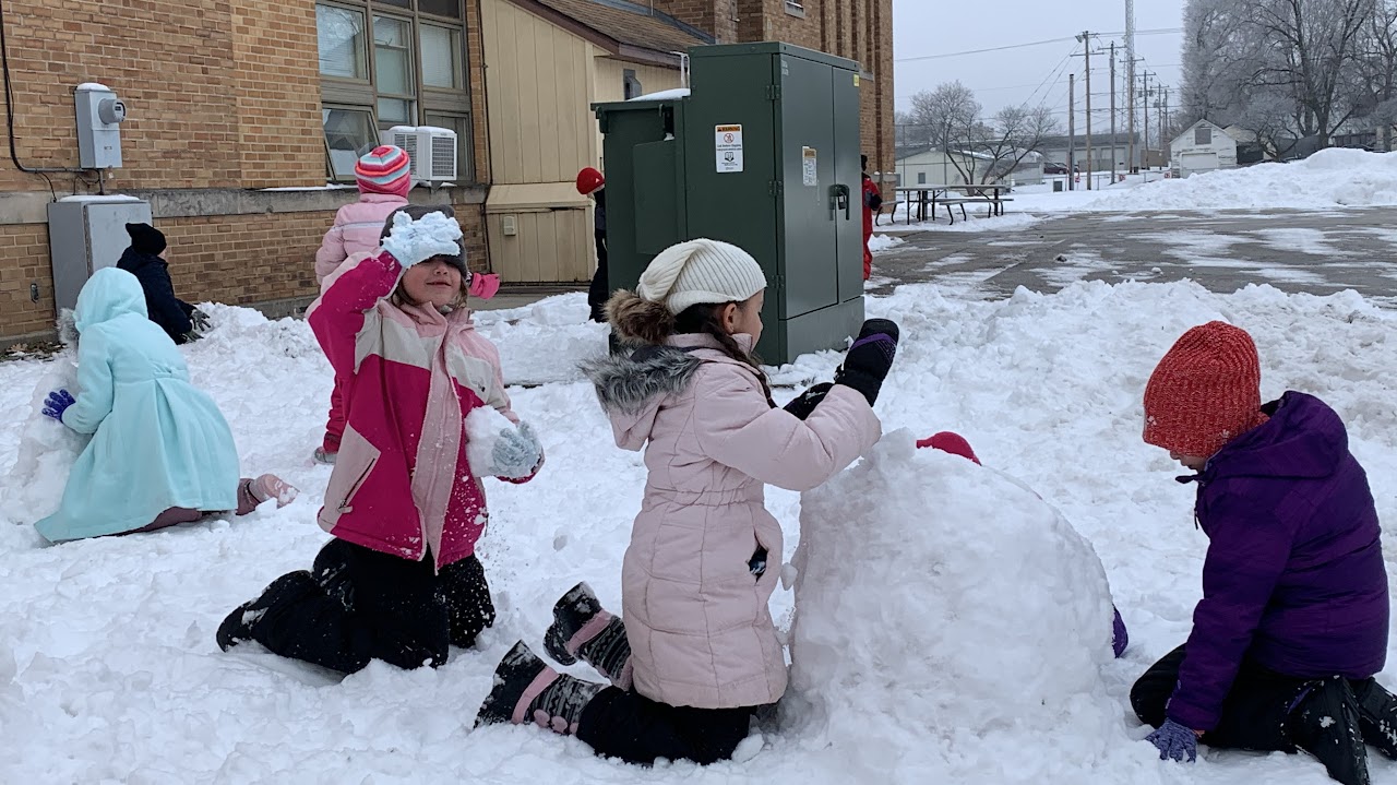 Students building snowmen