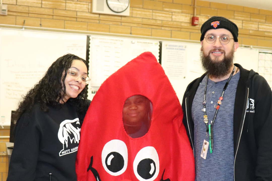 staff with red cross blood drop