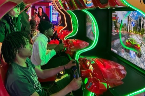 students playing arcade games