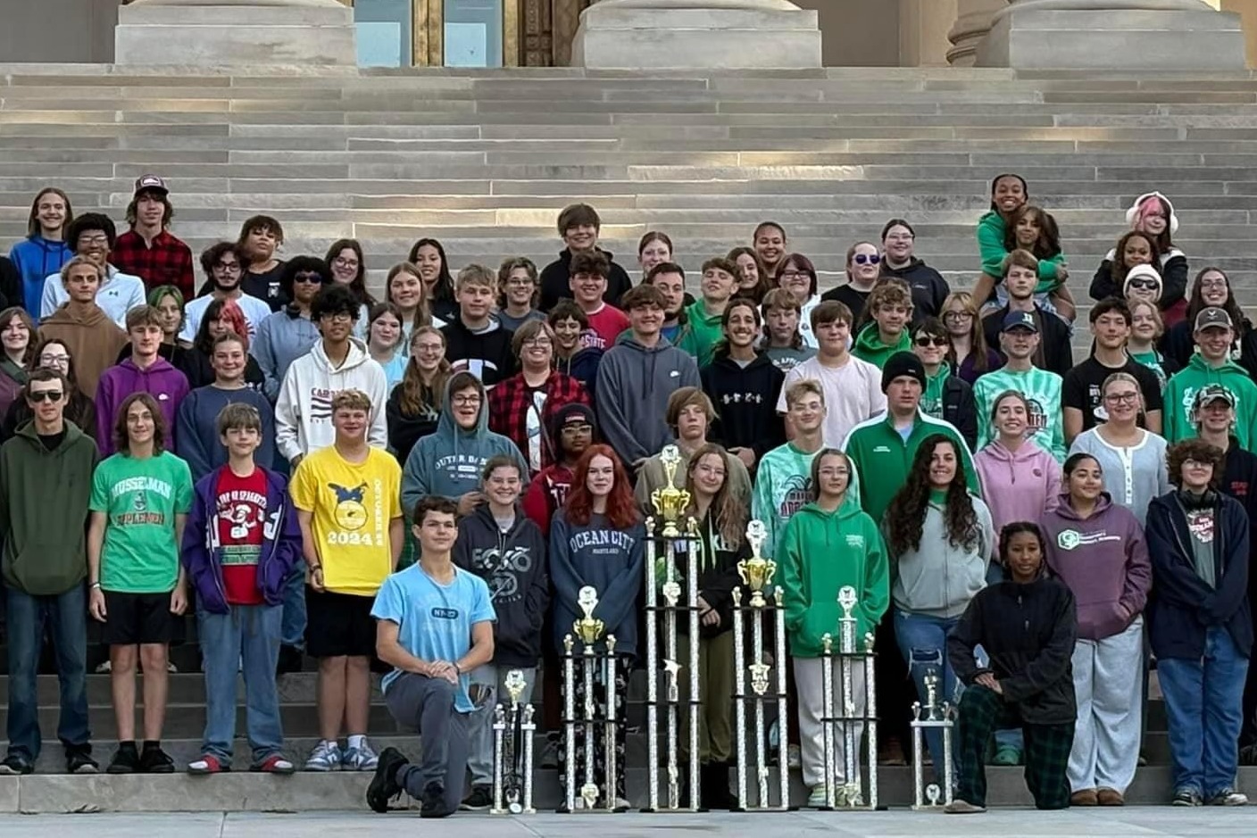 students with trophies