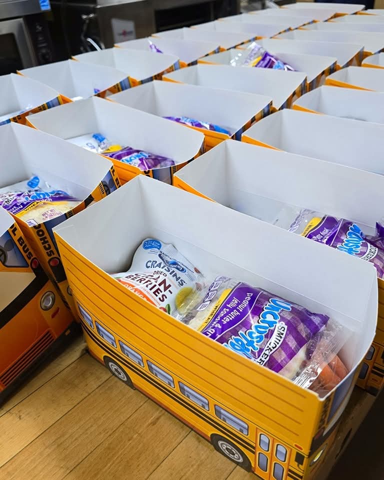 Photos of sack lunches packed in school bus boxes