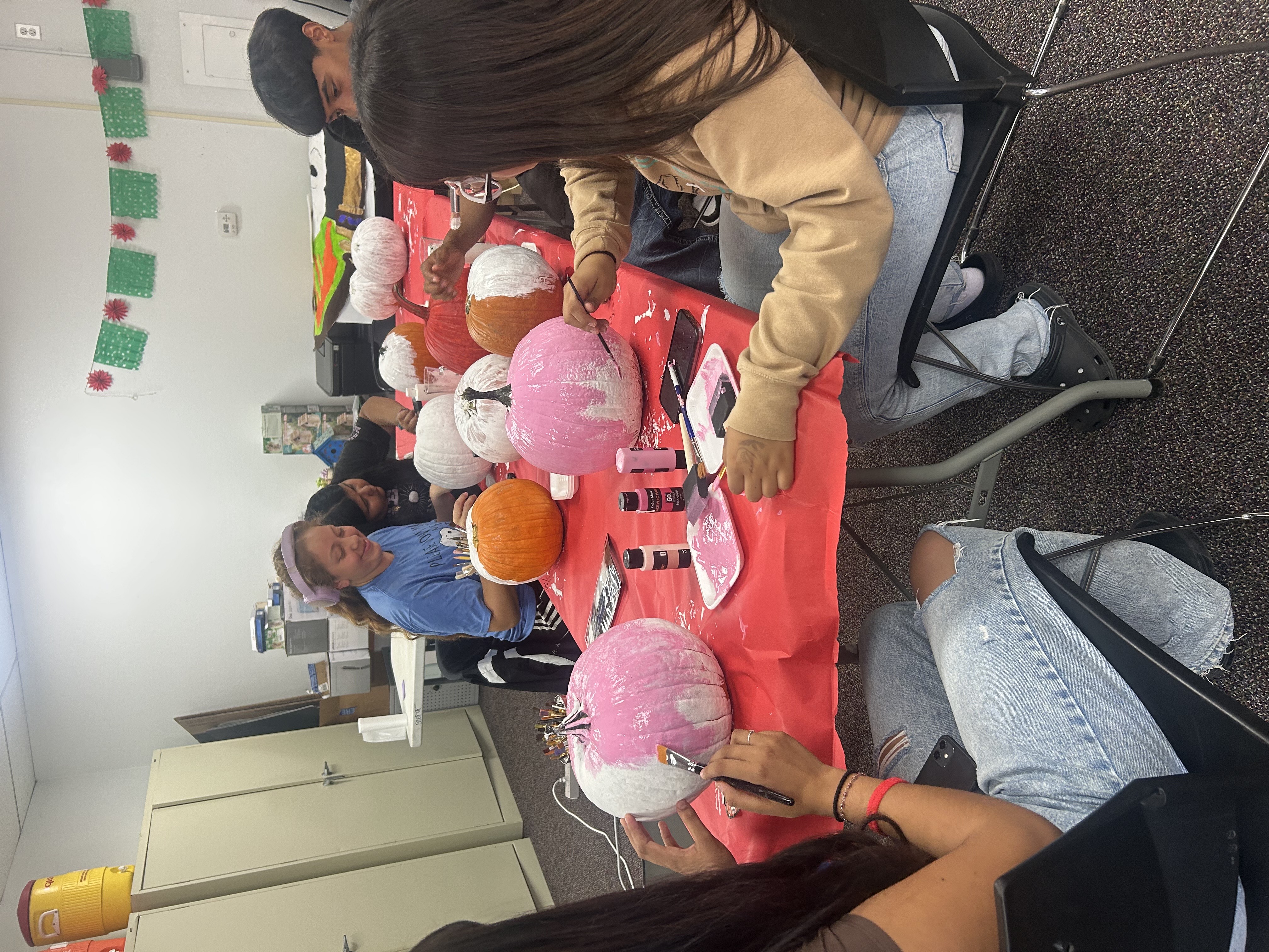 OHS Students painting pumpkins