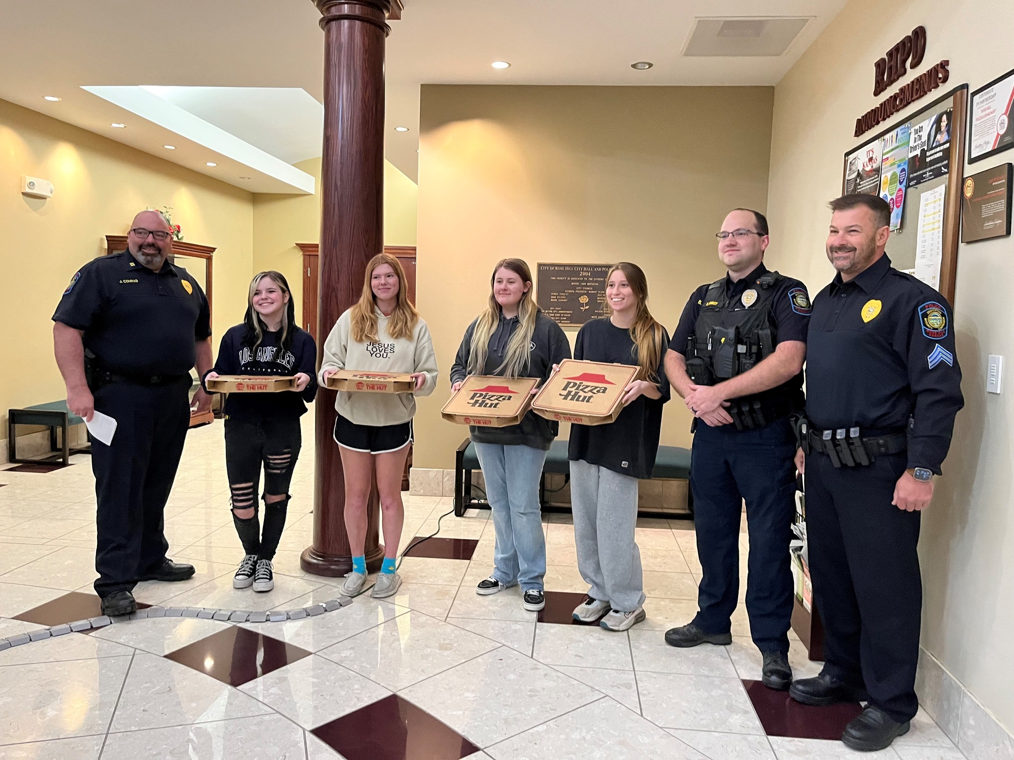 KAY Club delivering pizza to PD