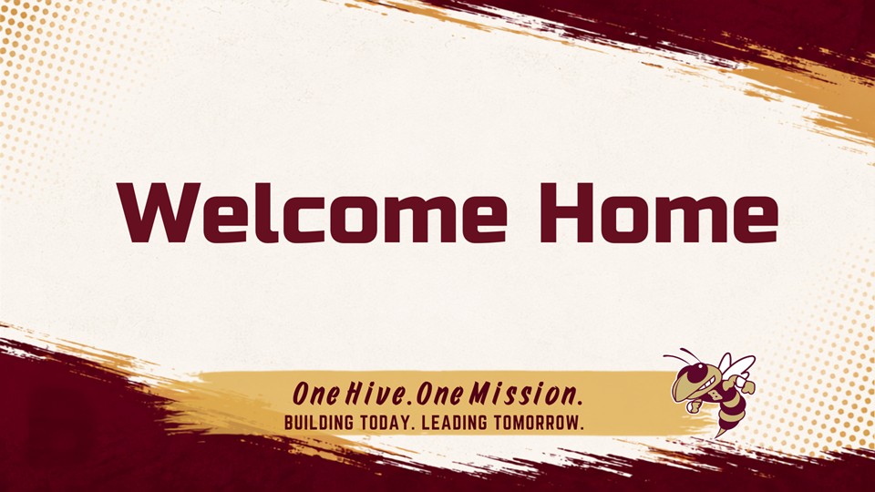 A poster says "Welcome Home" in bold, red text. A bee appears above the words "One Hive, One Mission."