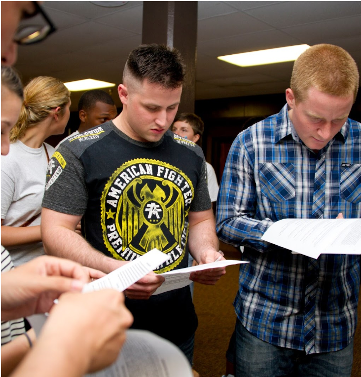 Students looking at papers