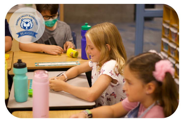 Bamber Valley students working with playdough at their desks.