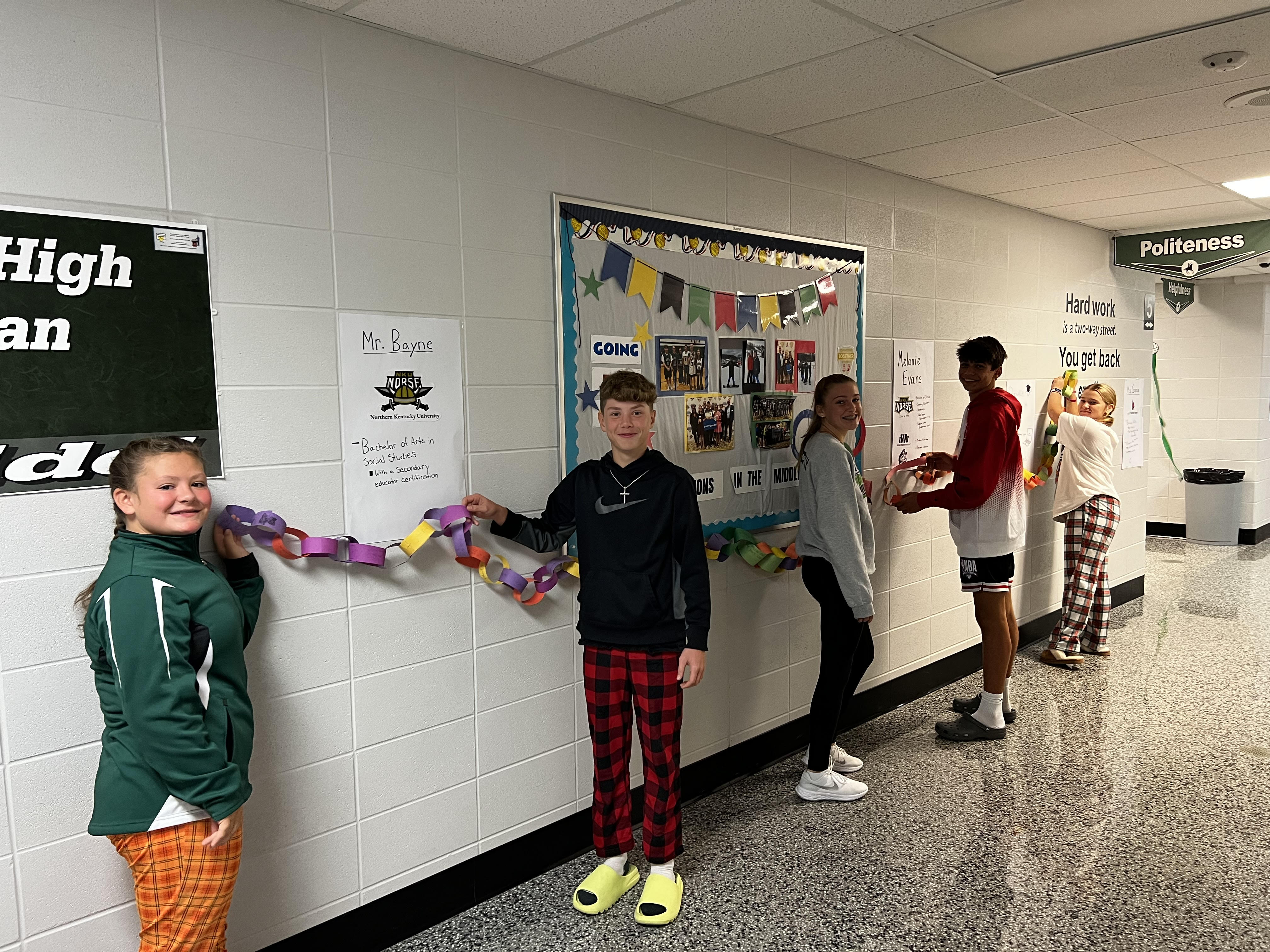 students showing off hallway decorations