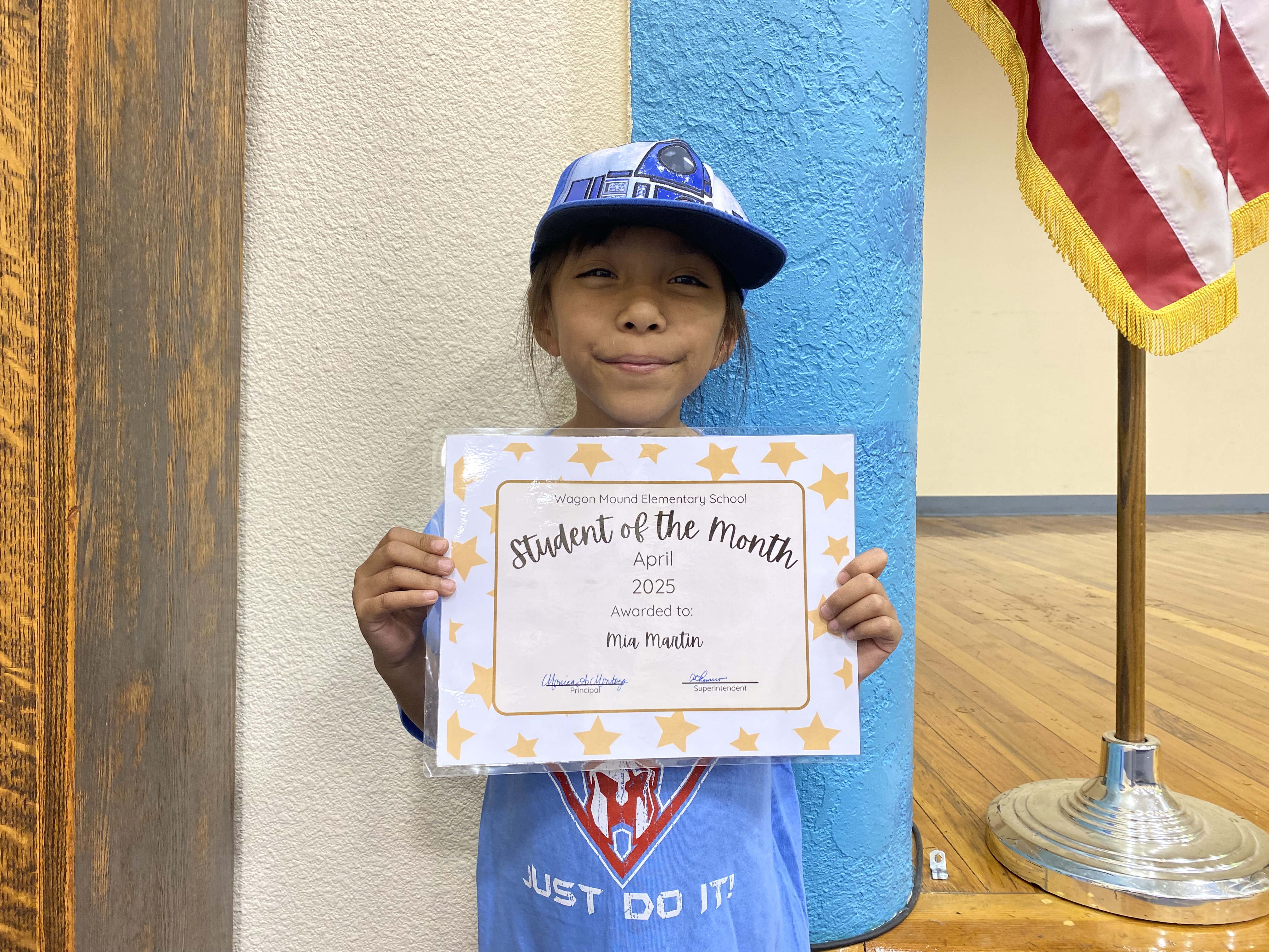 Little girl holding certificate